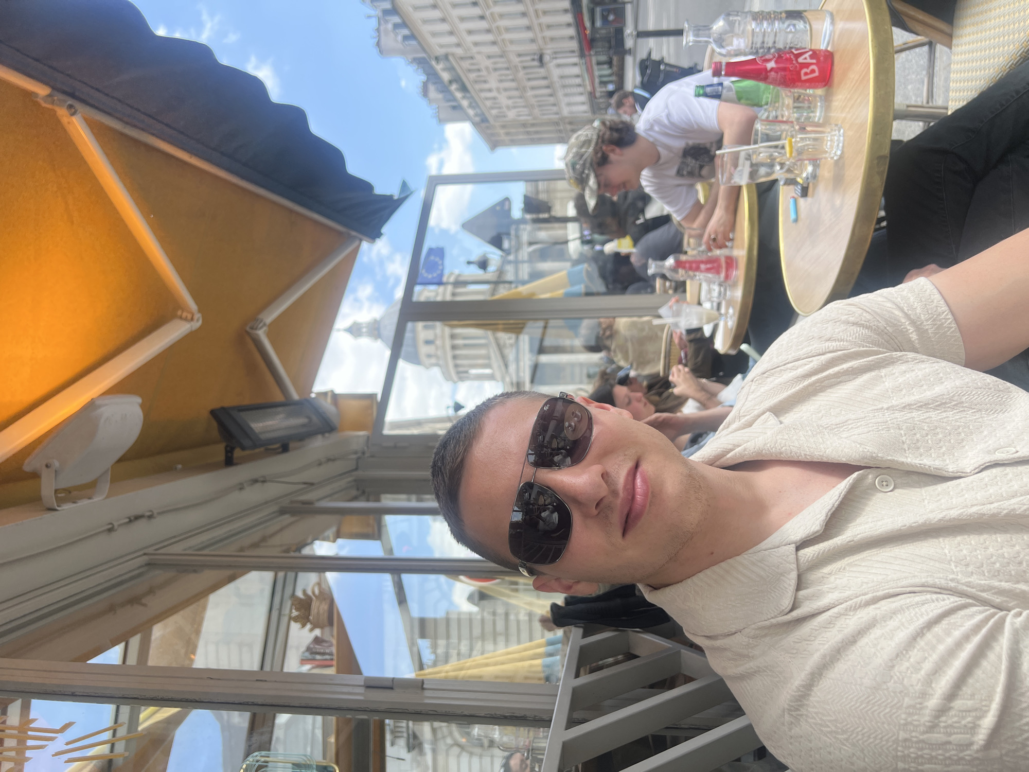 Couple enjoys sunny afternoon cafe date in Paris