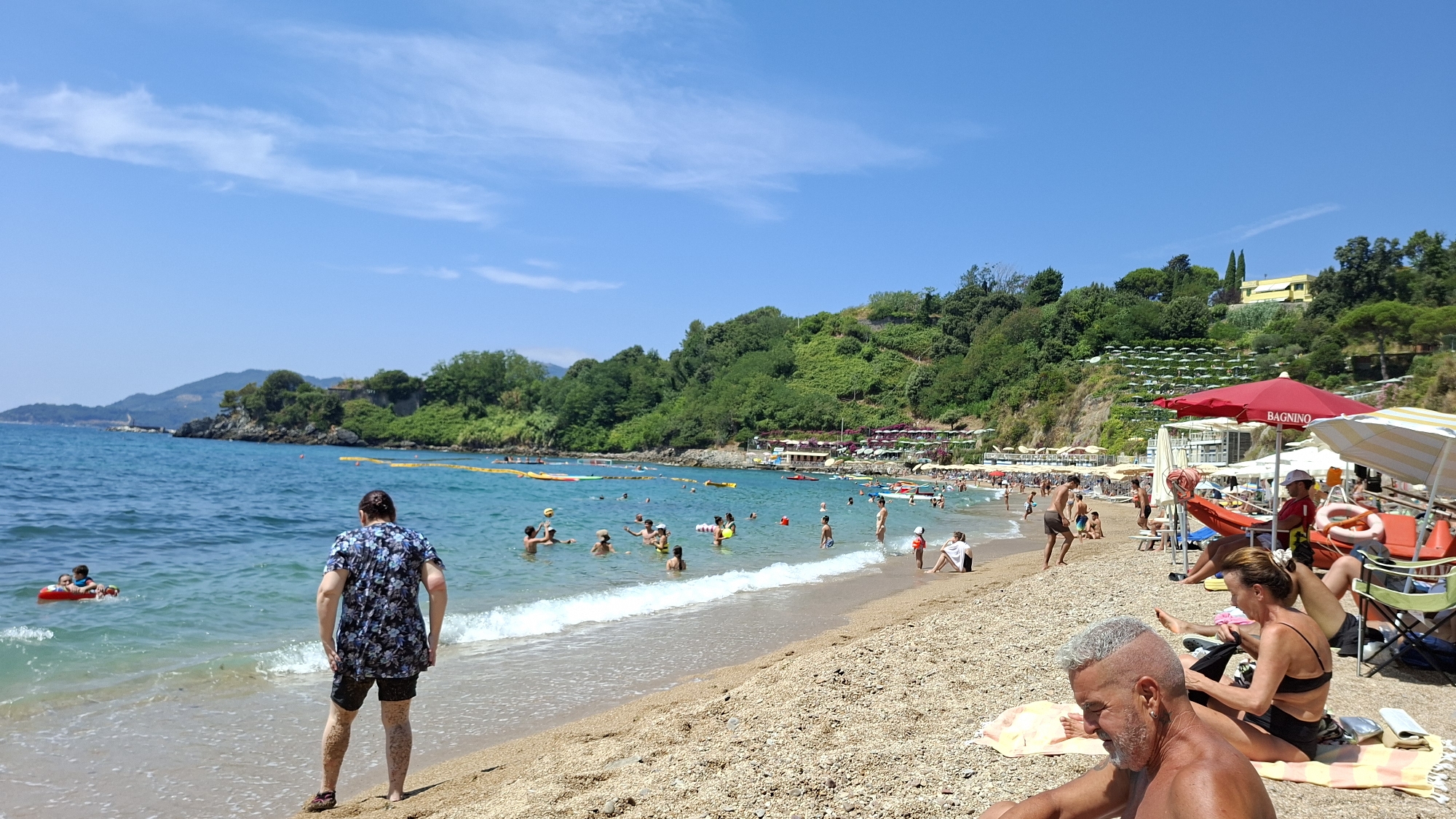 Crowded summer beach day along the Lerici coastline