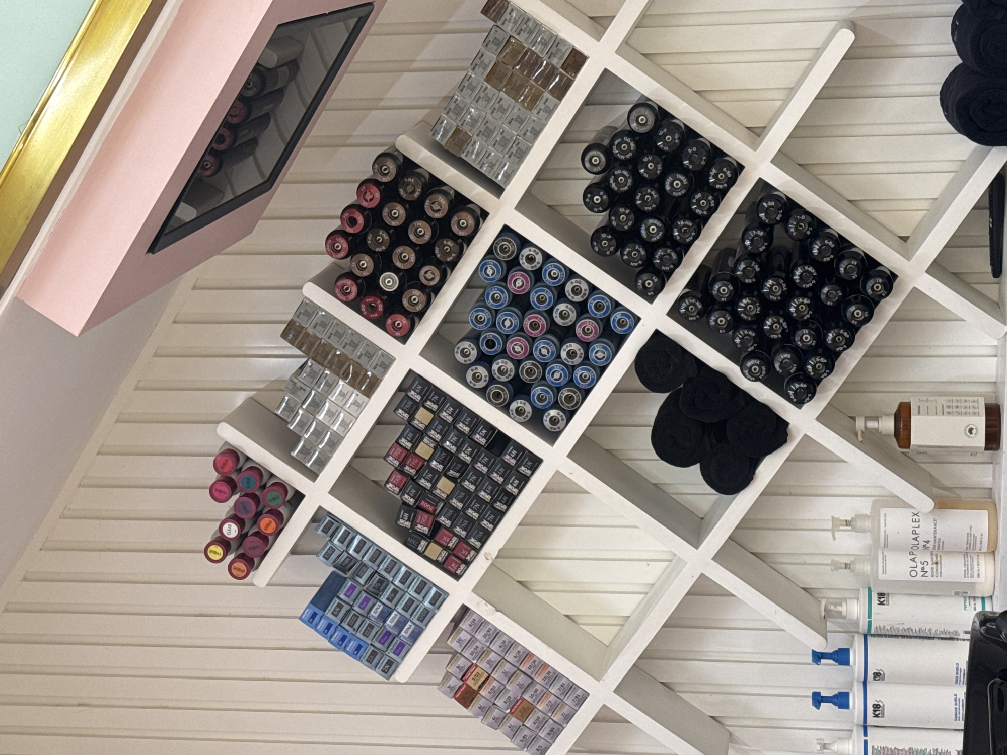 Beauty salon interior documented with products and roses
