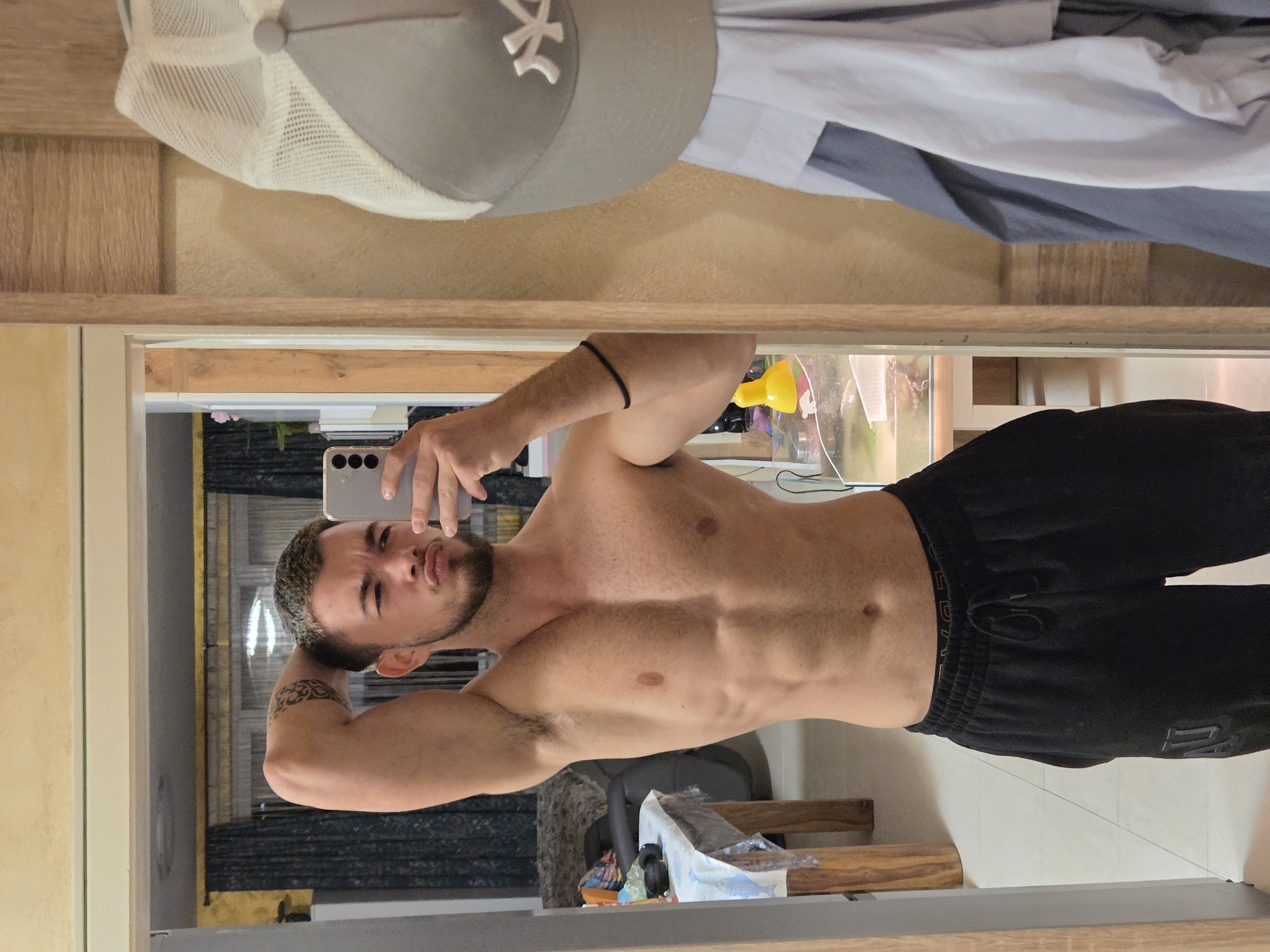 Man takes shirtless mirror selfie in Sofia