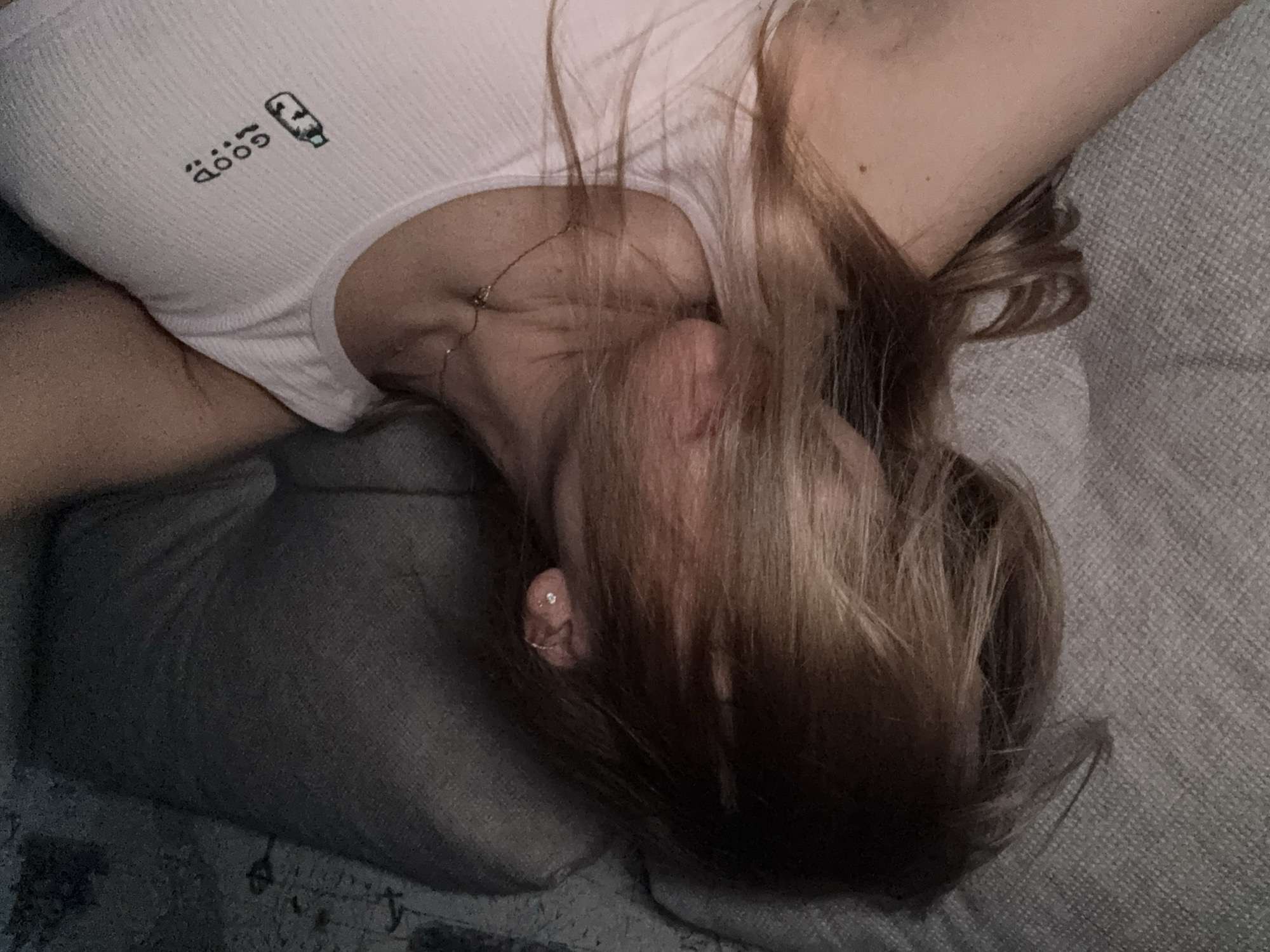 Person resting on sofa captured in Ust-Ilimsk home
