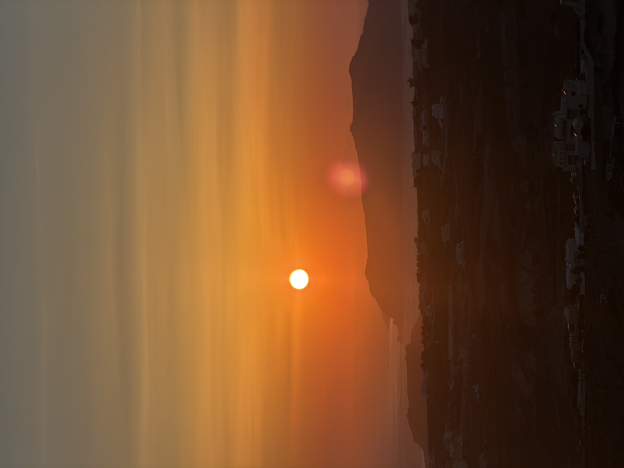 Santorini caldera sunset from multiple vantage points