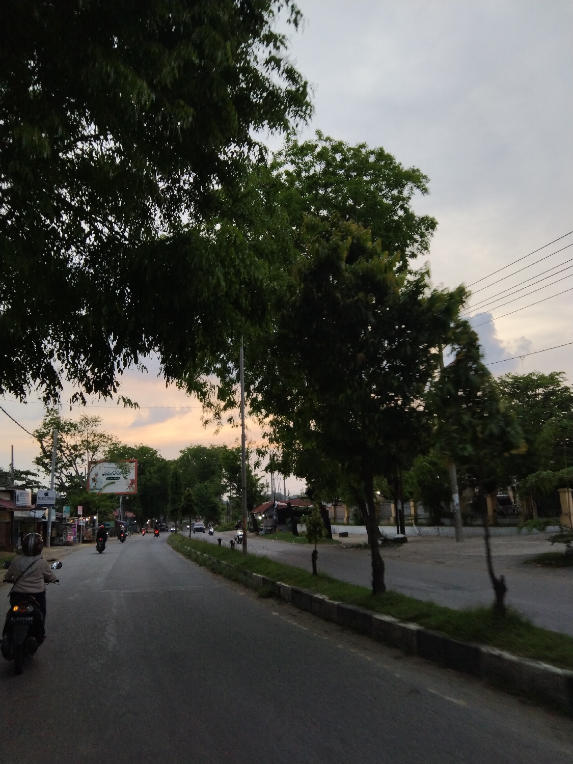 Twilight street scene captured in Lhokseumawe, Indonesia