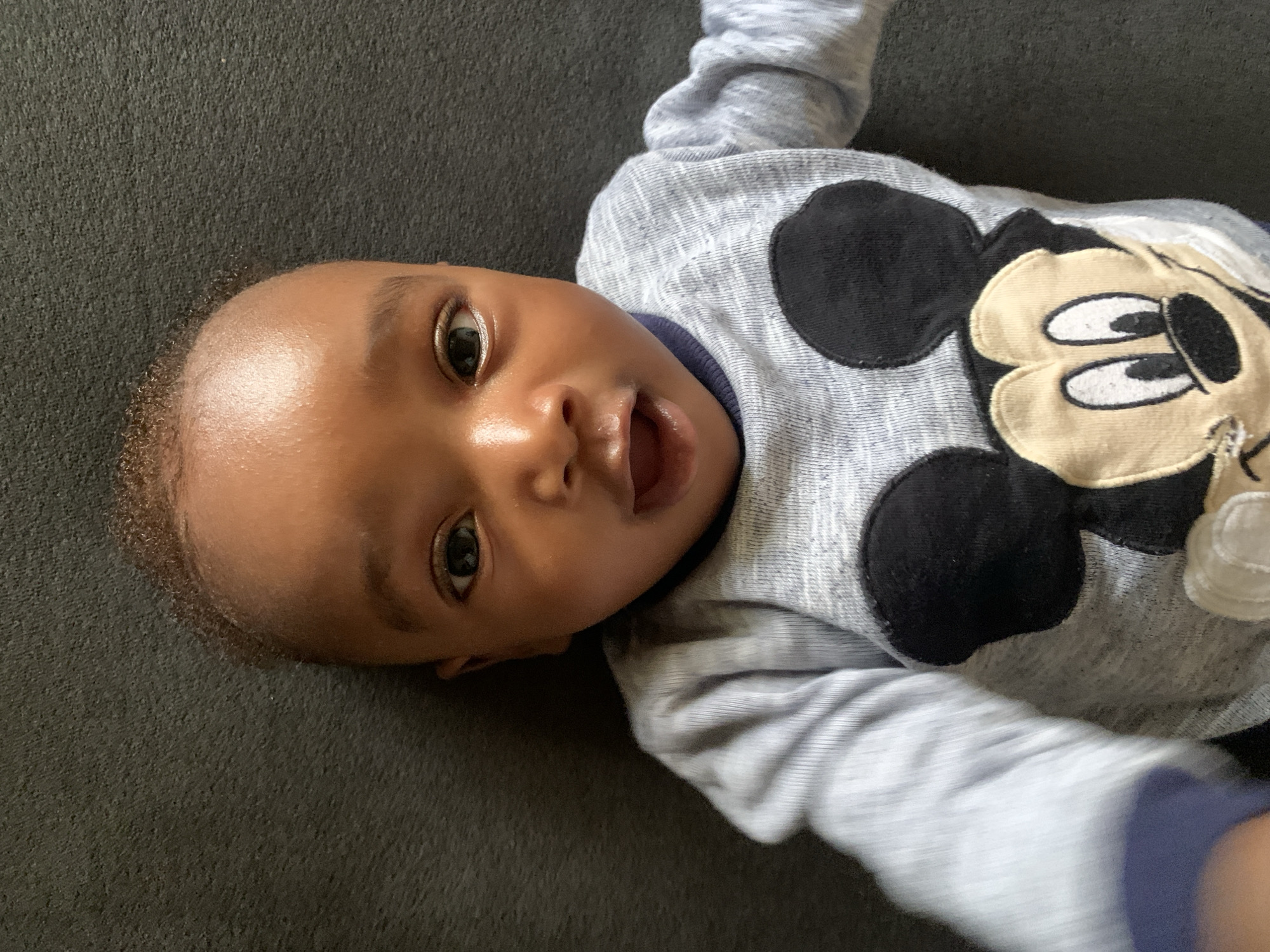 Baby in Mickey Mouse shirt observed in Nigeria