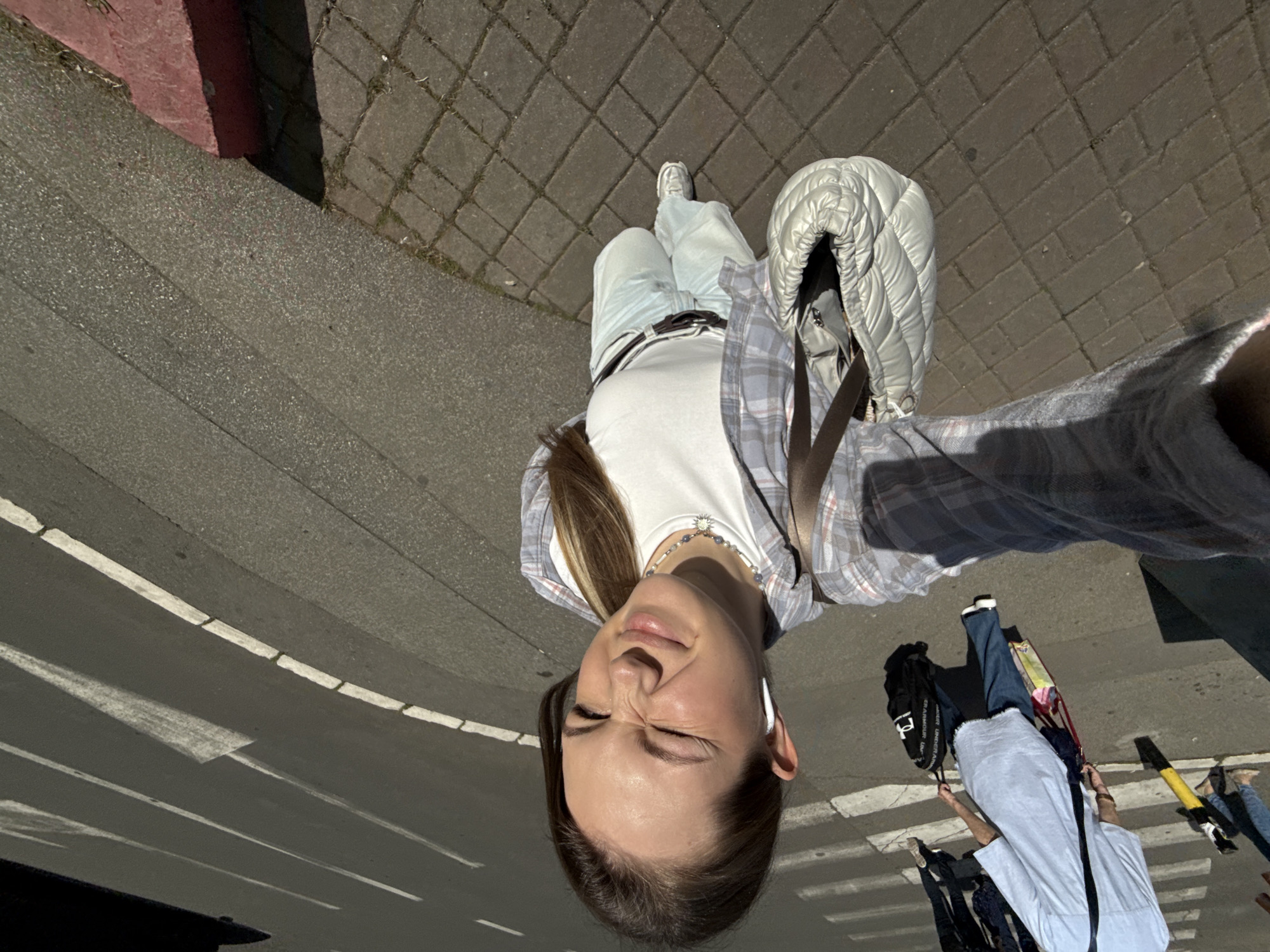 Woman Takes Selfie on Belgrade Street Sidewalk