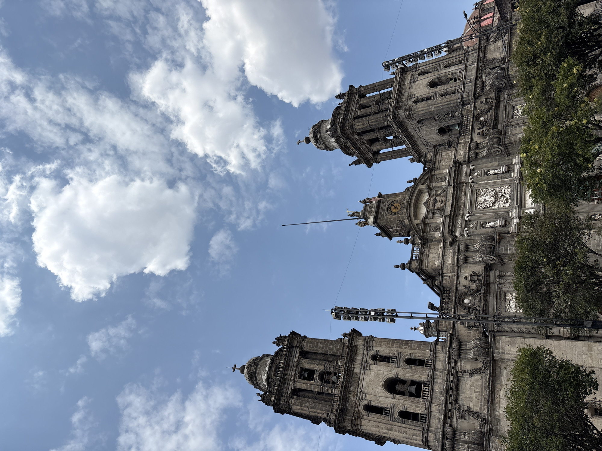 Tourist documents Mexico City's Metropolitan Cathedral exterior and interior