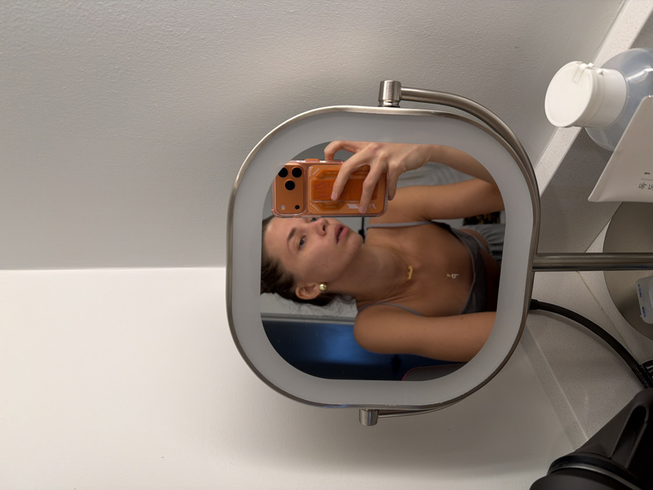 Woman takes mirror selfies in Fort Lauderdale evening