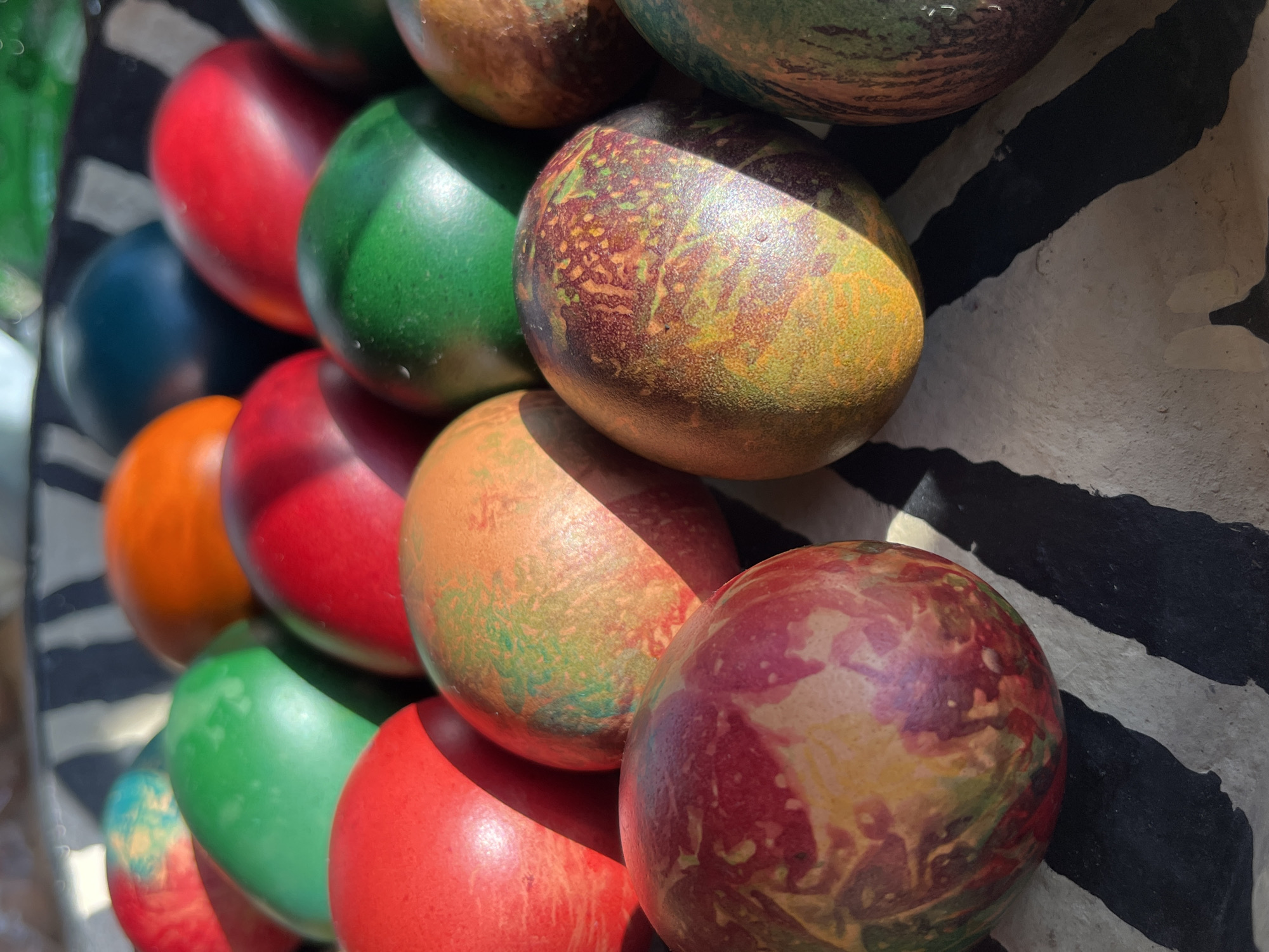 Colorful wooden ornament spheres displayed in Pchelnik, Bulgaria