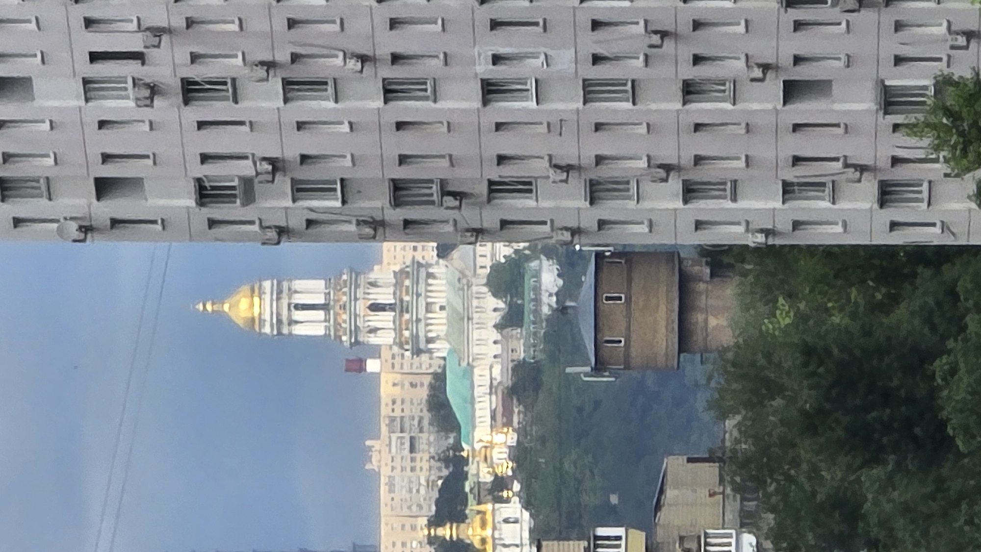 Inverted urban view shows grey multi-story building architecture