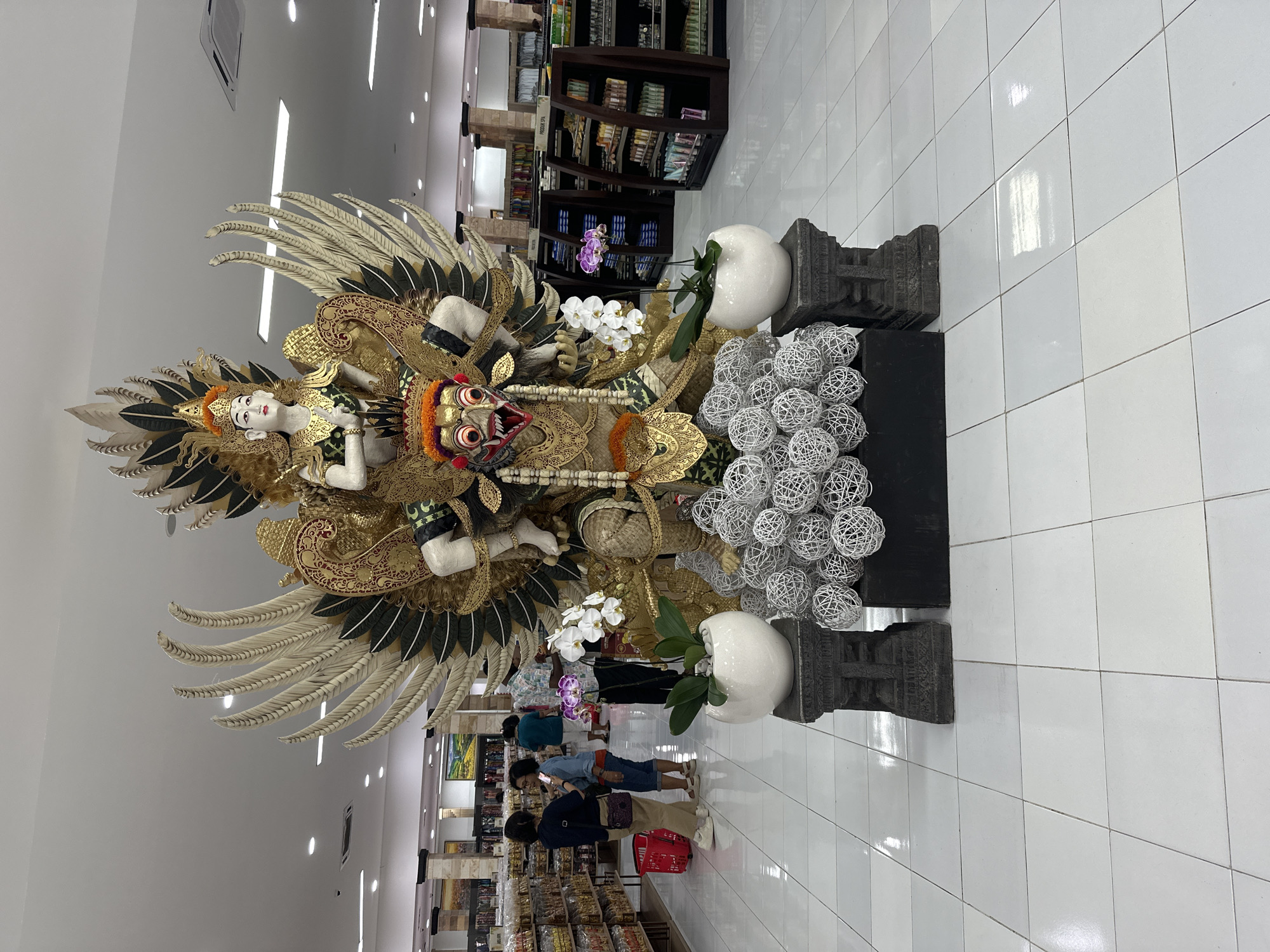 Ornate Garuda Wisnu Kencana statue displayed in Kuta shop