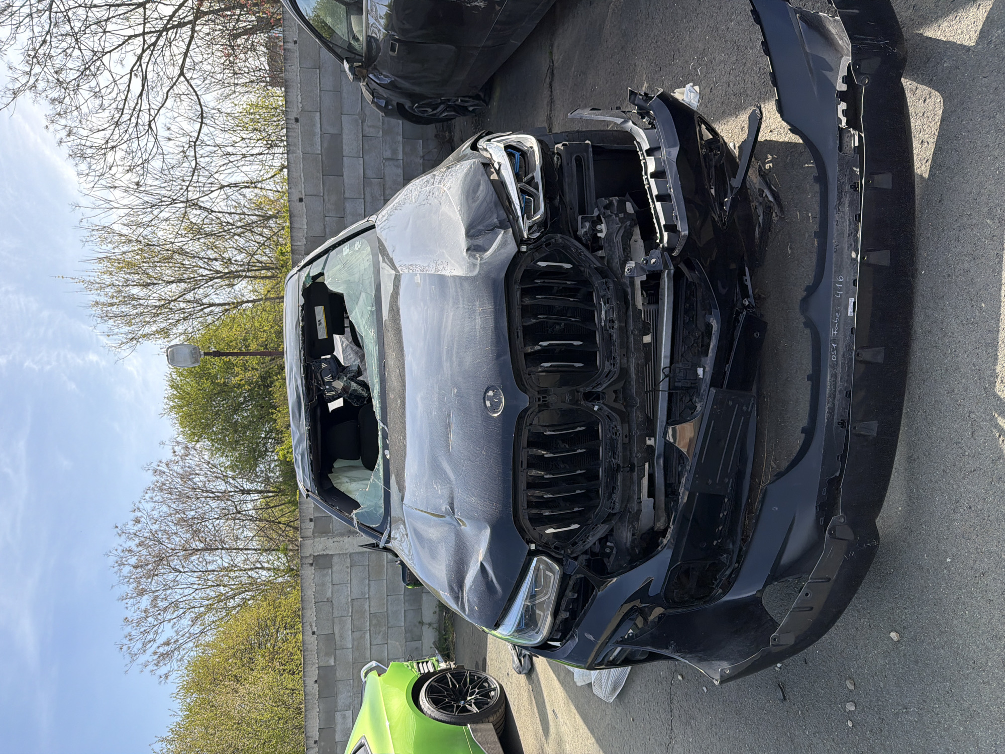 Damaged BMW SUV spotted at automotive facility