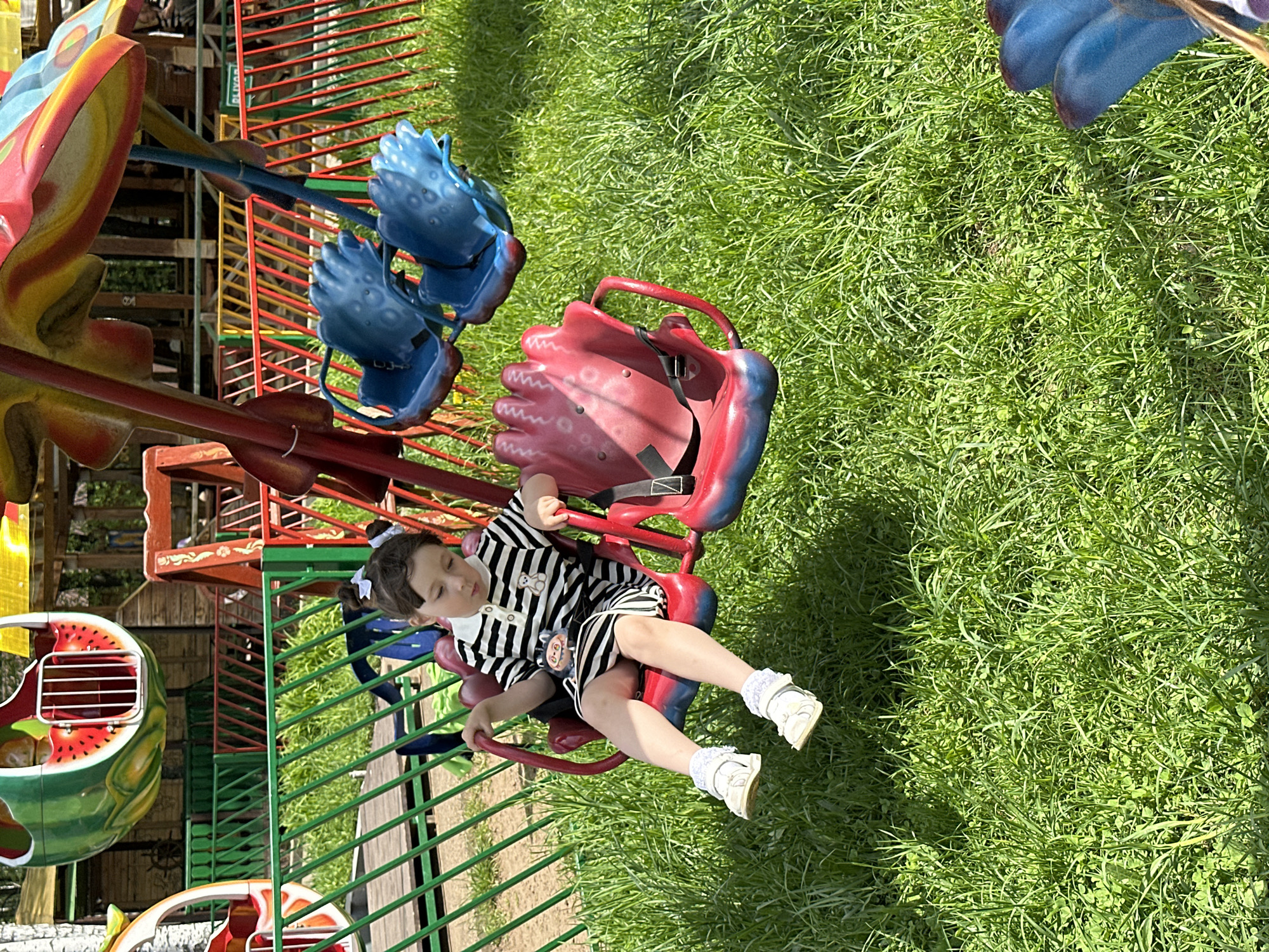 Family enjoys morning carousel rides at Chaikovsky park
