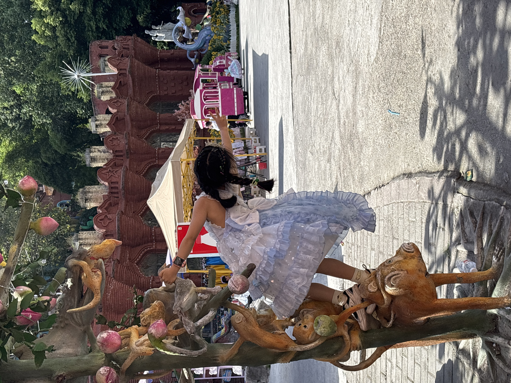 Girl in tiara poses at whimsical park in China