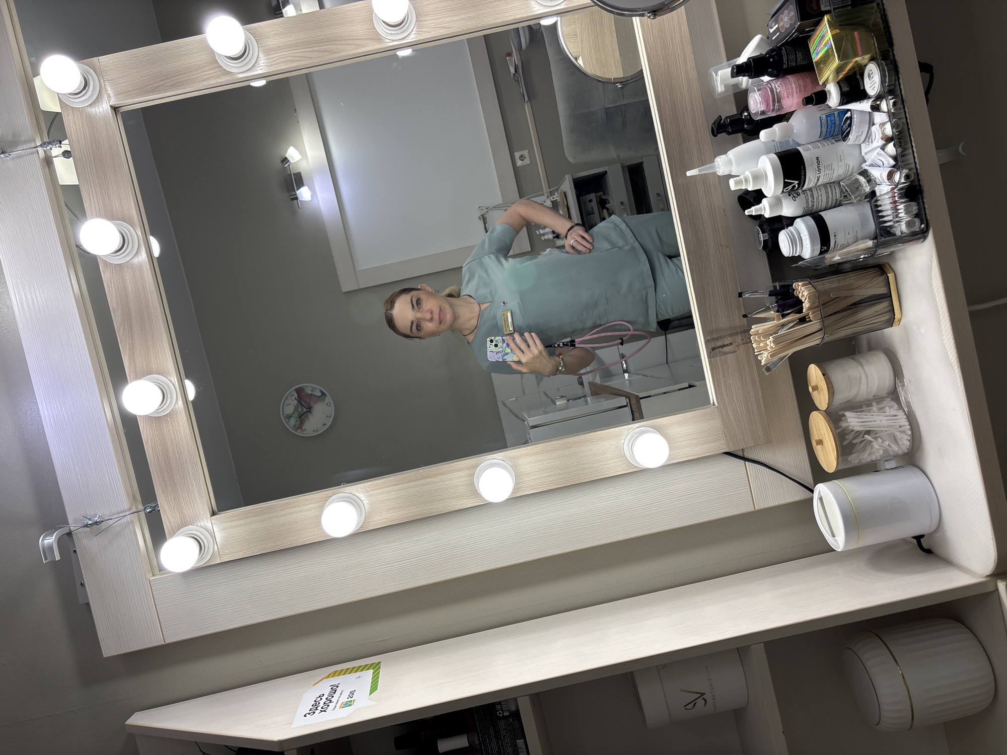 Quick selfies in scrubs at a salon or clinic near Lake Ladoga
