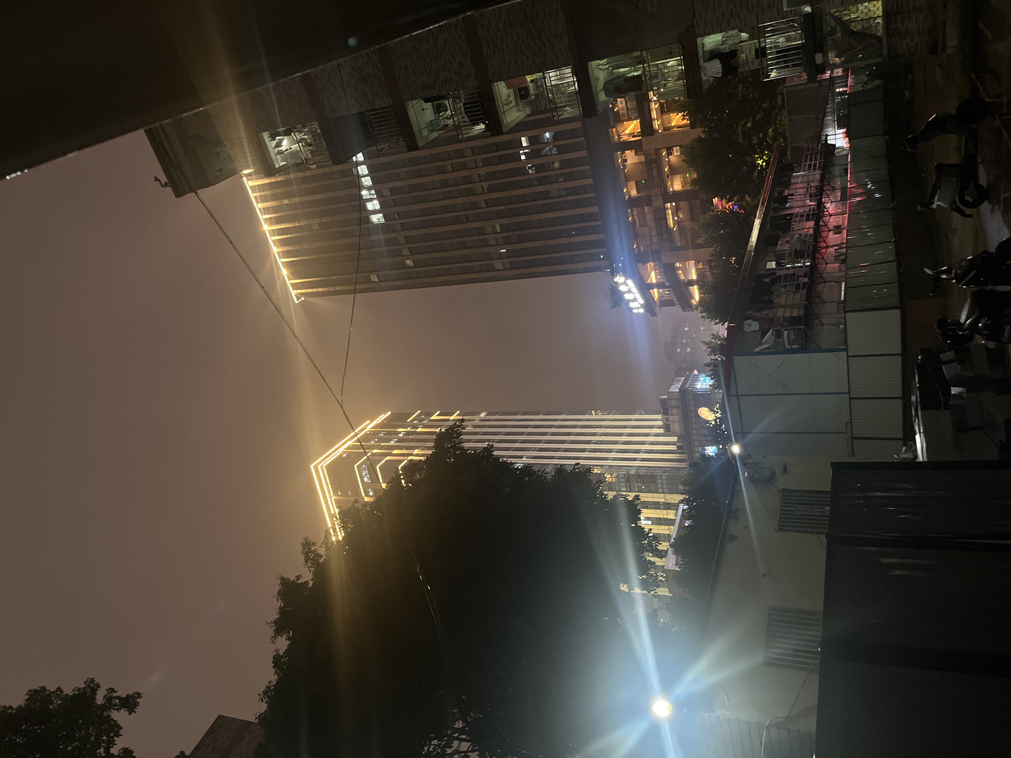 Nighttime urban scenes documented in rainy Yuzhong District, China
