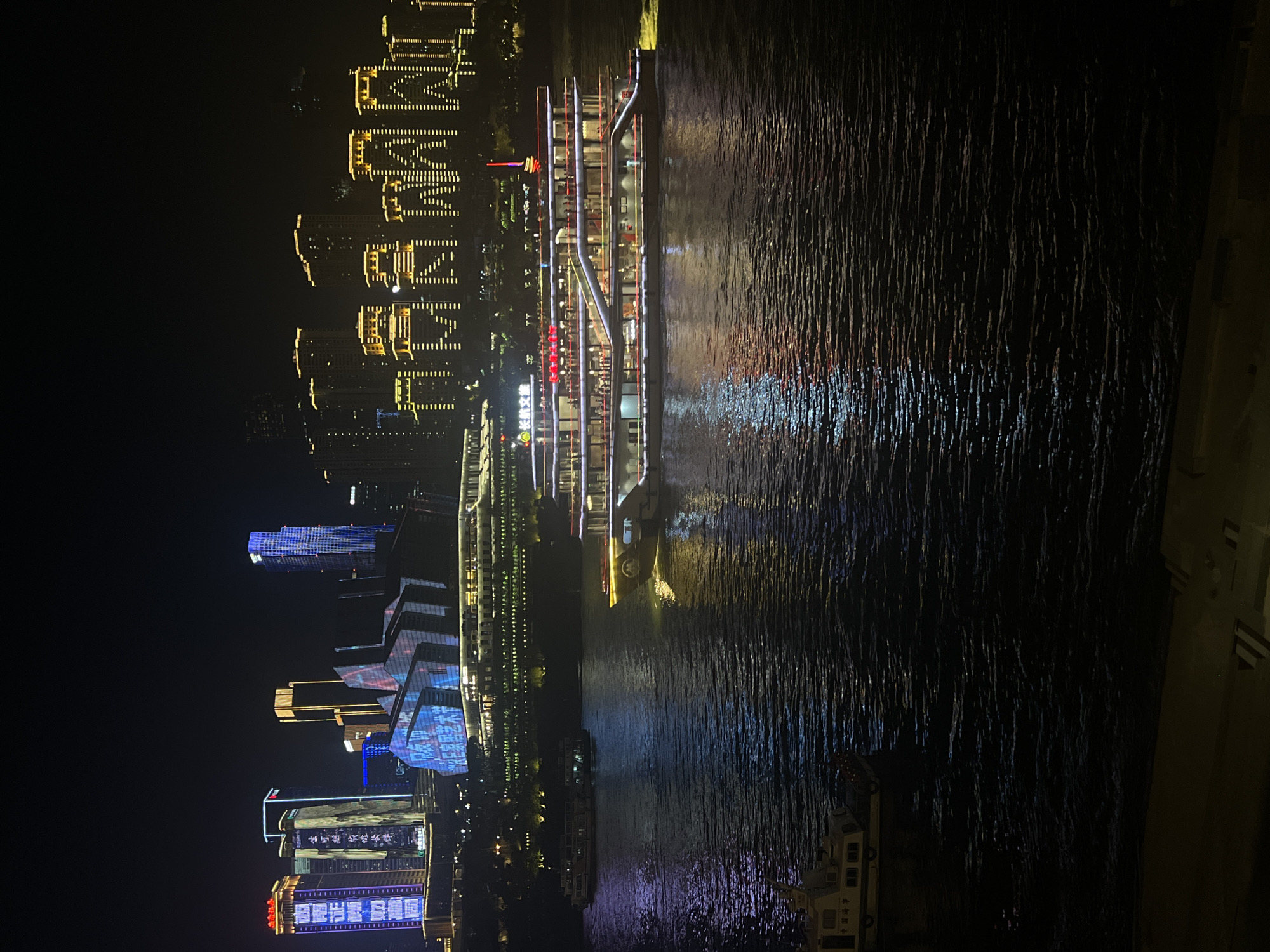 Chongqing's Yangtze riverfront lights up after dark