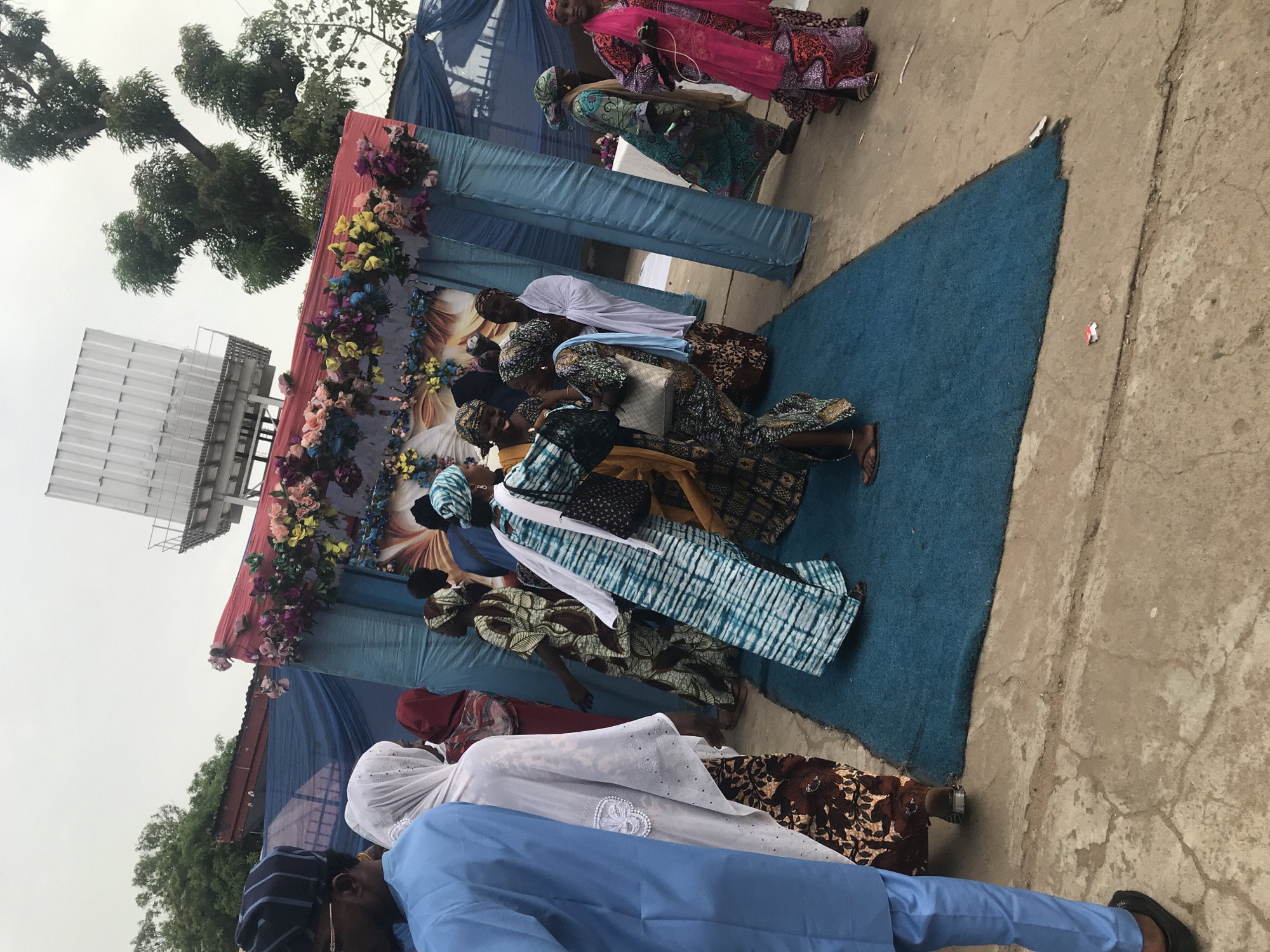 Traditional-dressed women gather at outdoor event in Lokoja, Nigeria
