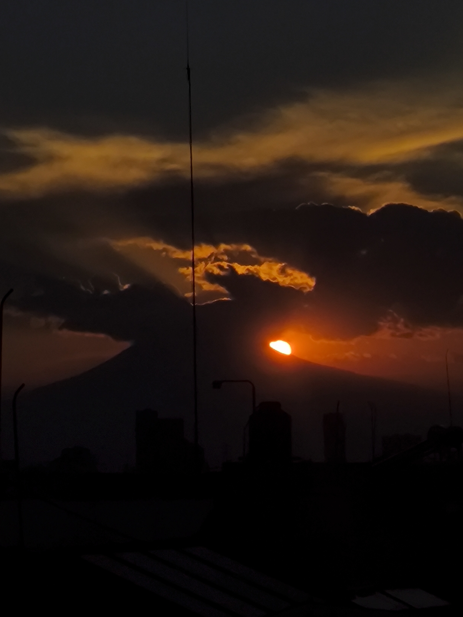 Sunset over Puebla cityscape with Popocatépetl volcano backdrop