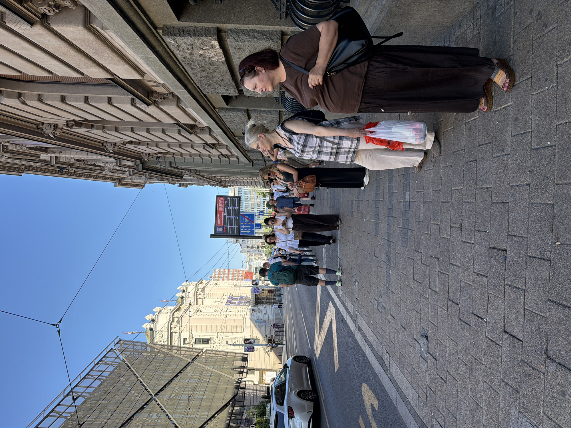 Flower vendor set up on a sunny Belgrade sidewalk