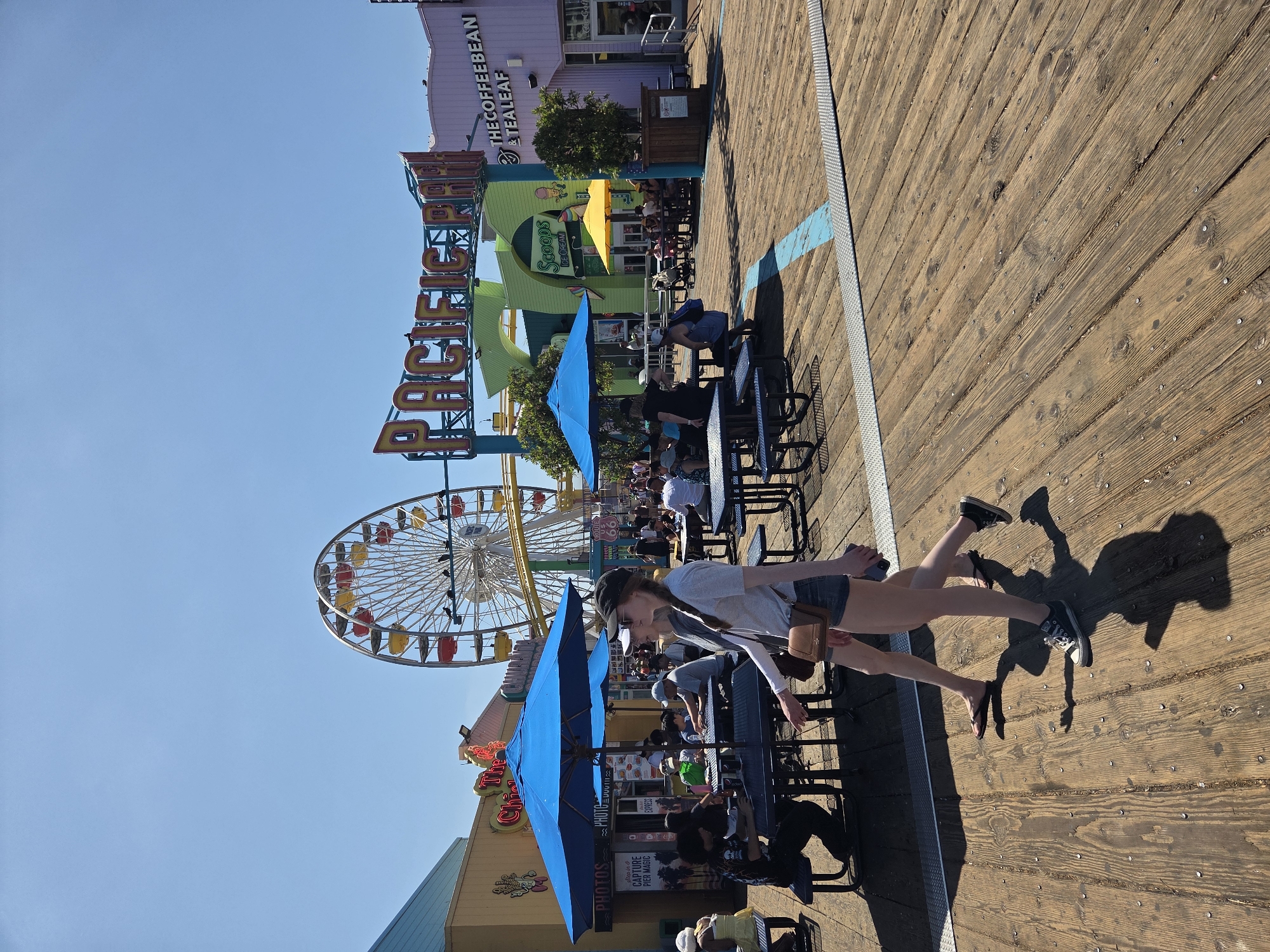 Busy summer afternoon at Santa Monica Pier and beach