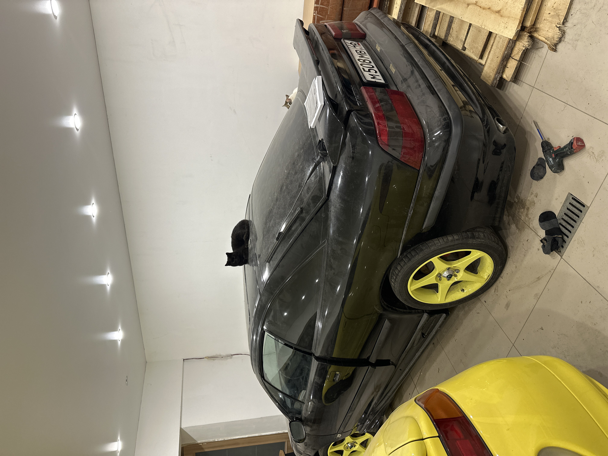 Black car spotted in Kursk garage with regional plates