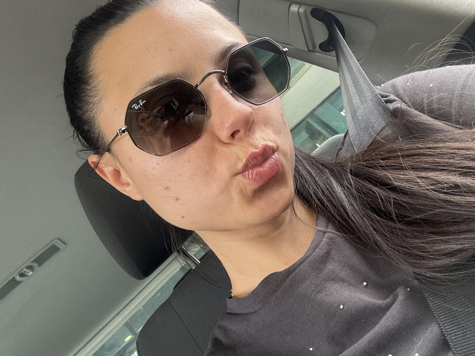 Woman photographed in car driver's seat in Sliven, Bulgaria