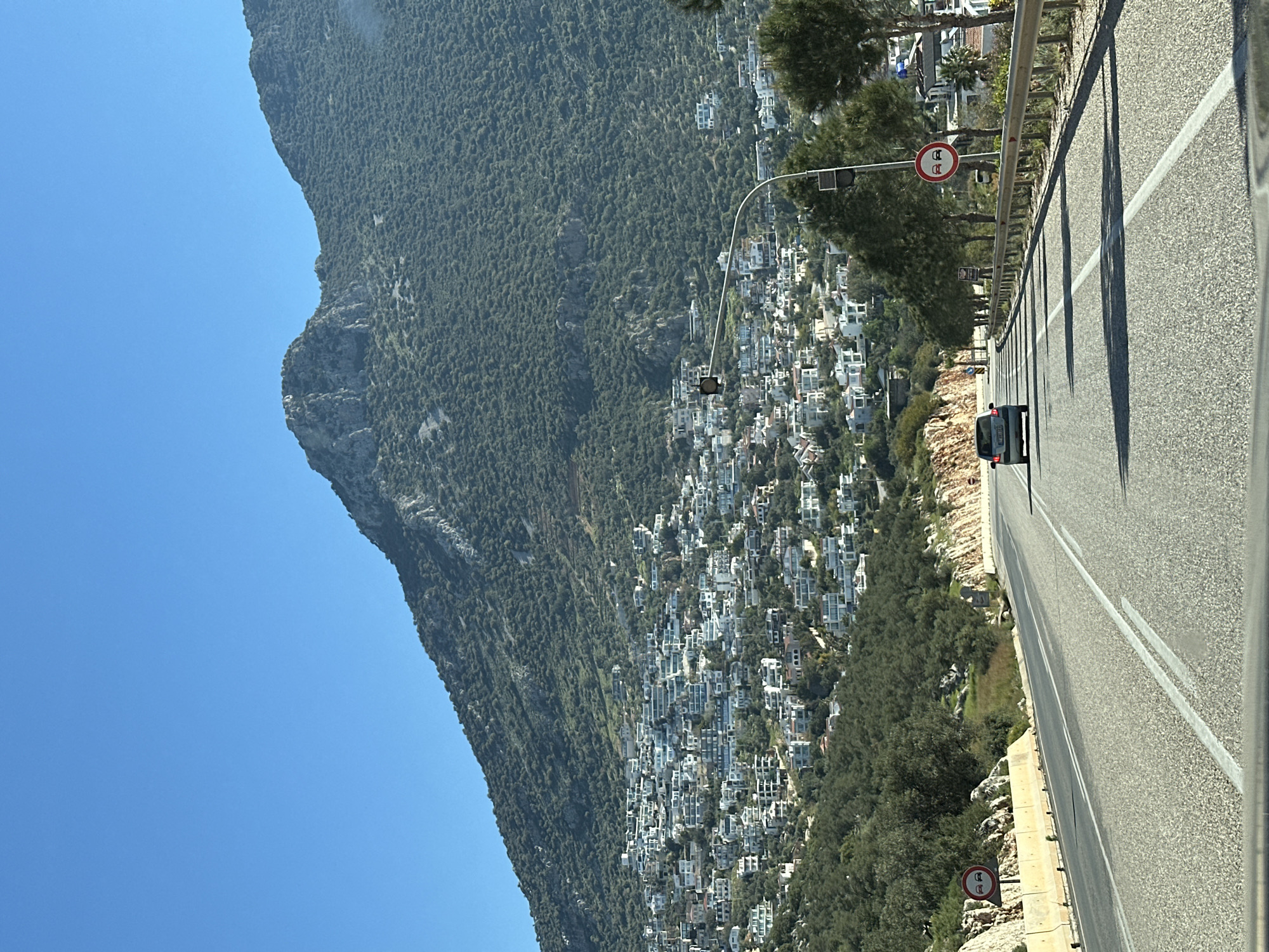 Morning traffic captured on hillside road in Kaş, Turkey