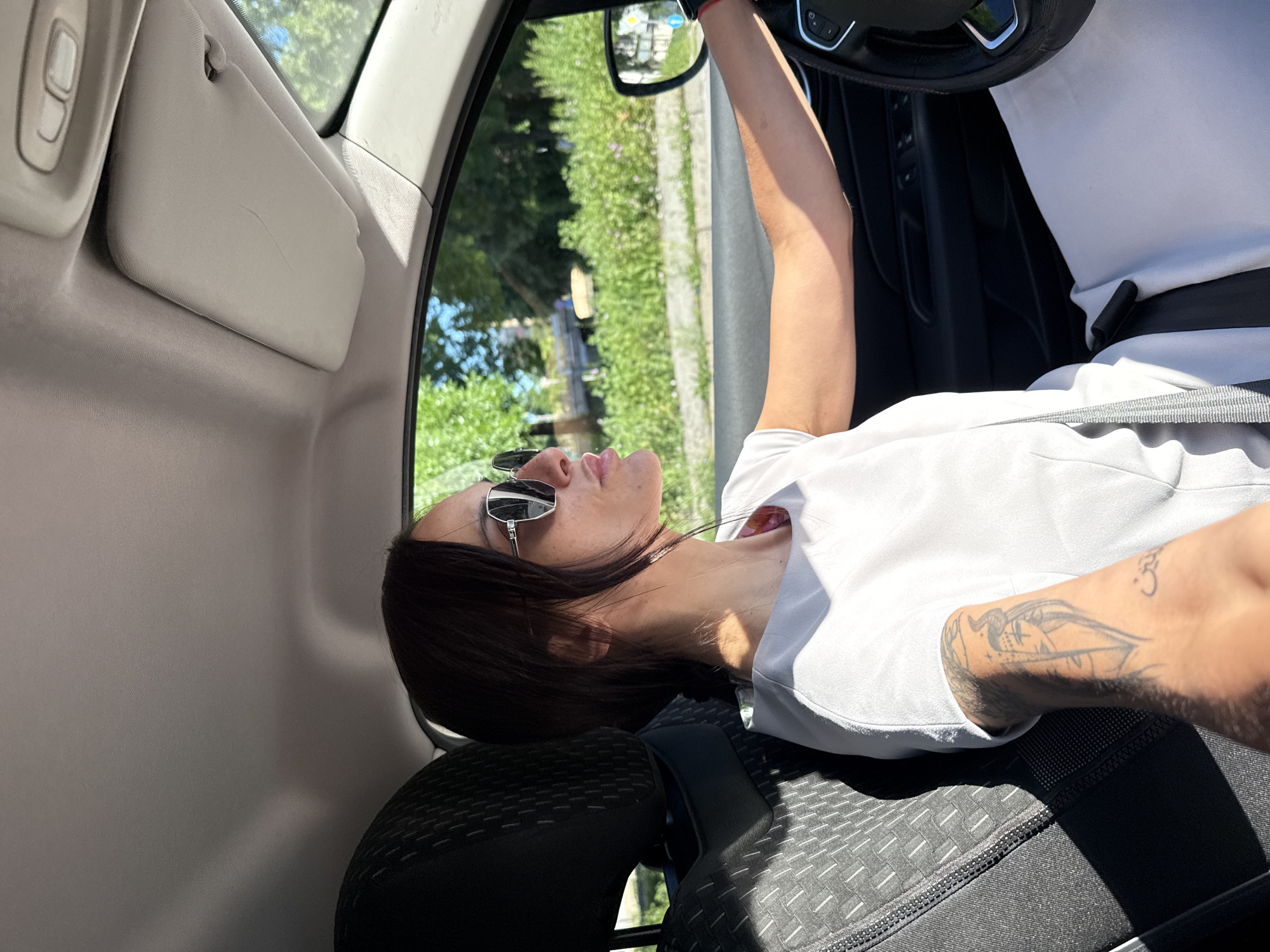 Woman rests in driver's seat in Pleven, Bulgaria