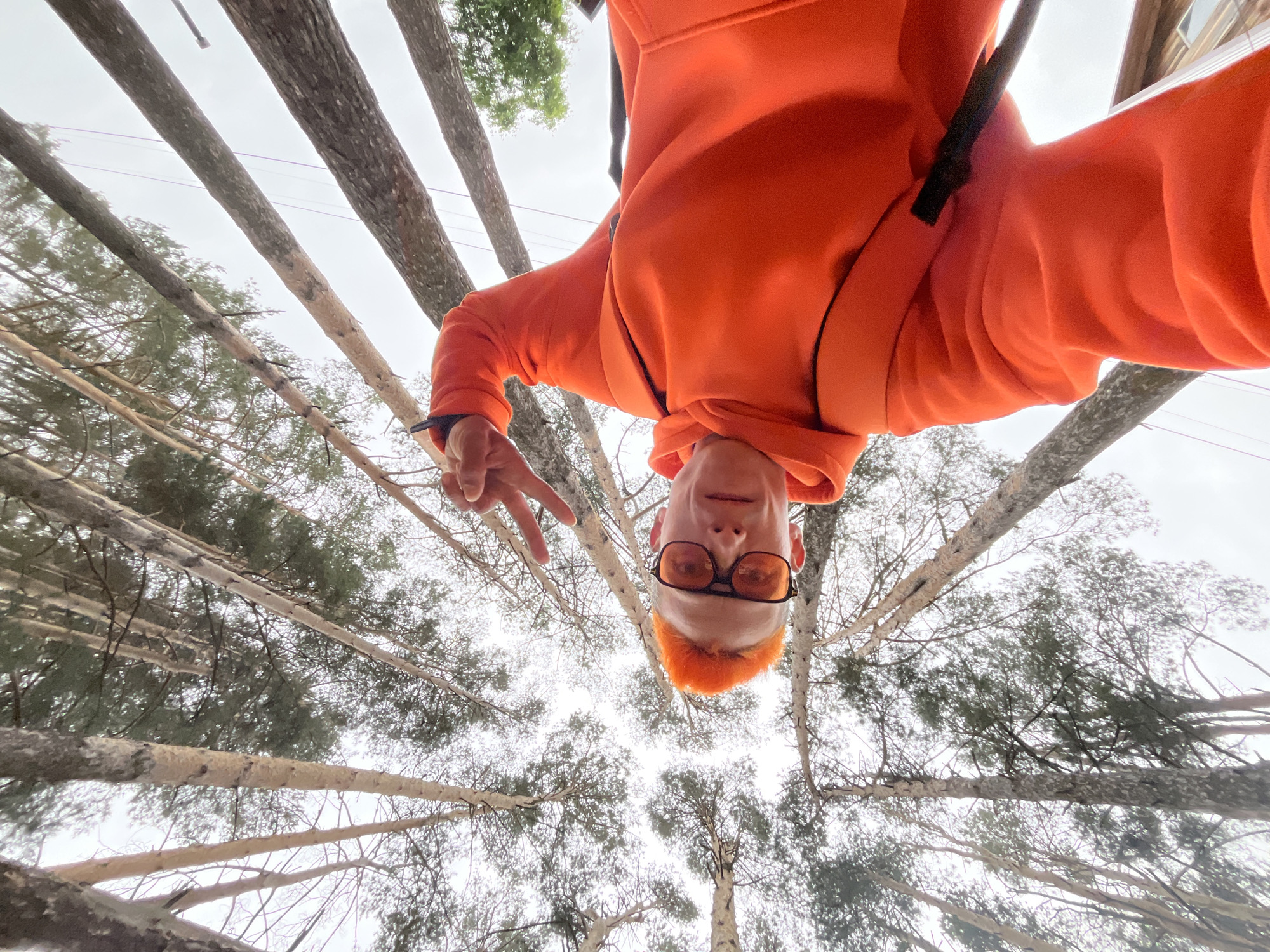 Orange-clad person photographed in Russian forest at night
