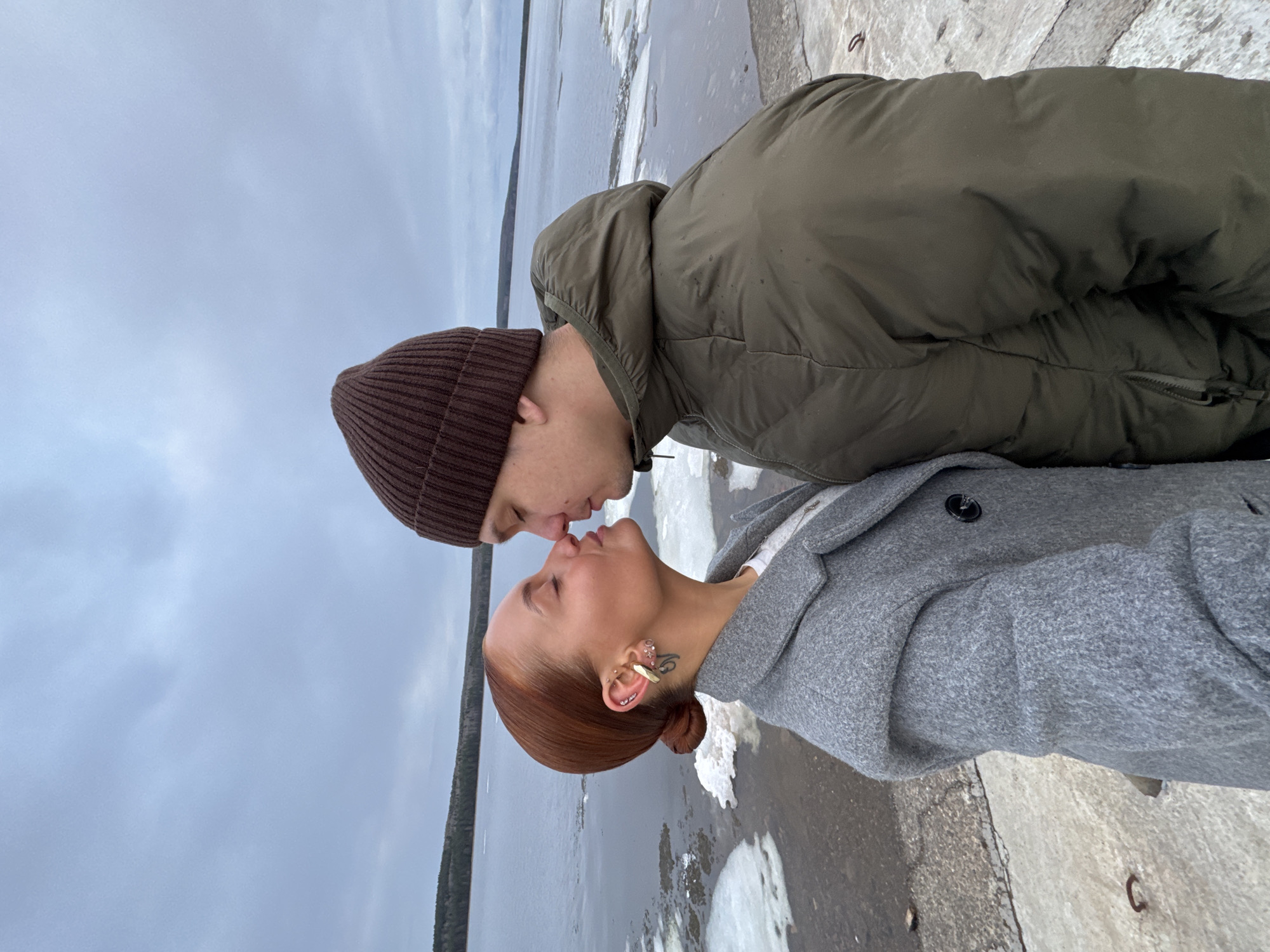 Couple shares intimate moment by water in Chaikovsky