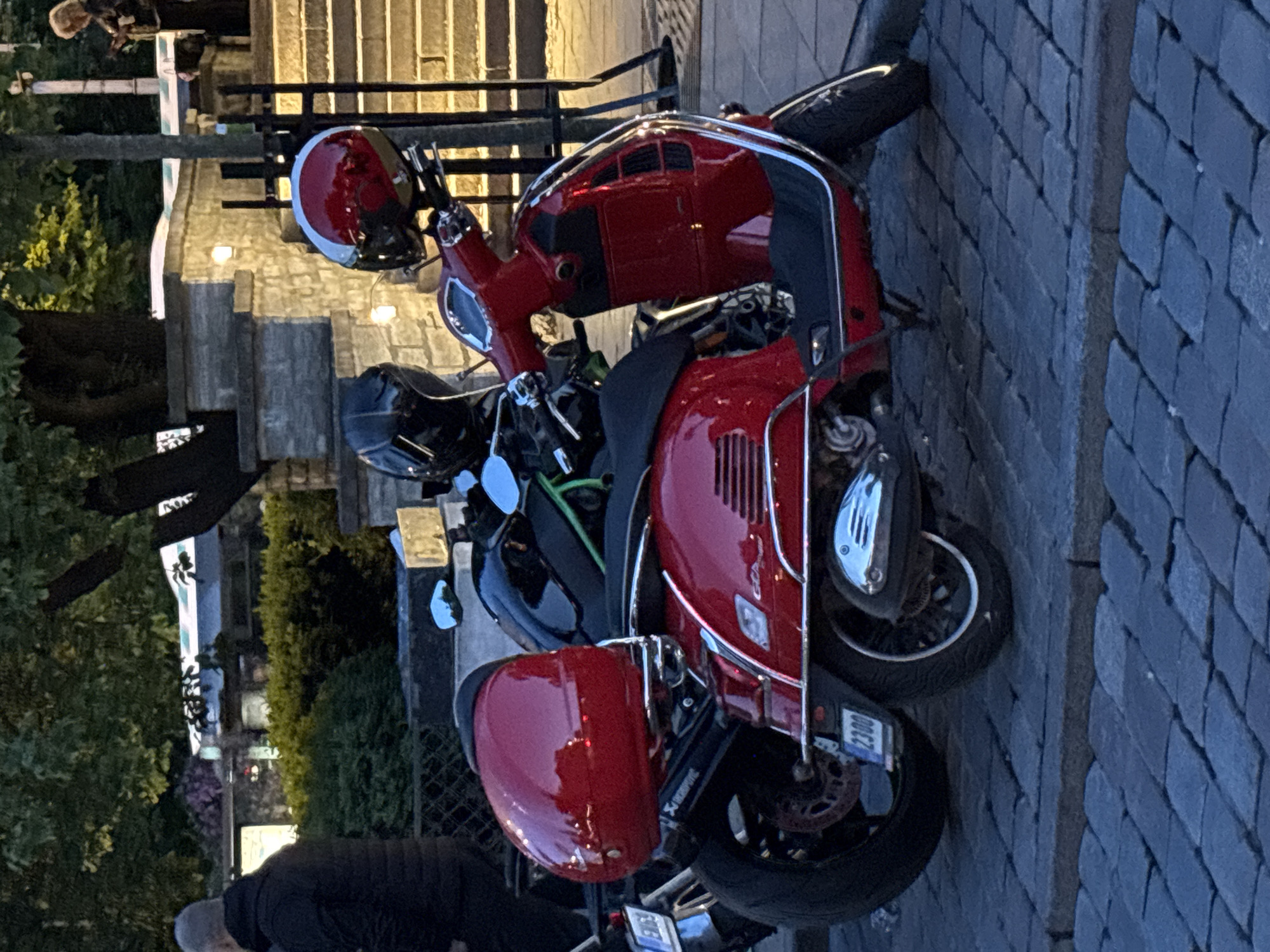 Evening motorcycle gathering in Tallinn Old Town cobblestone streets