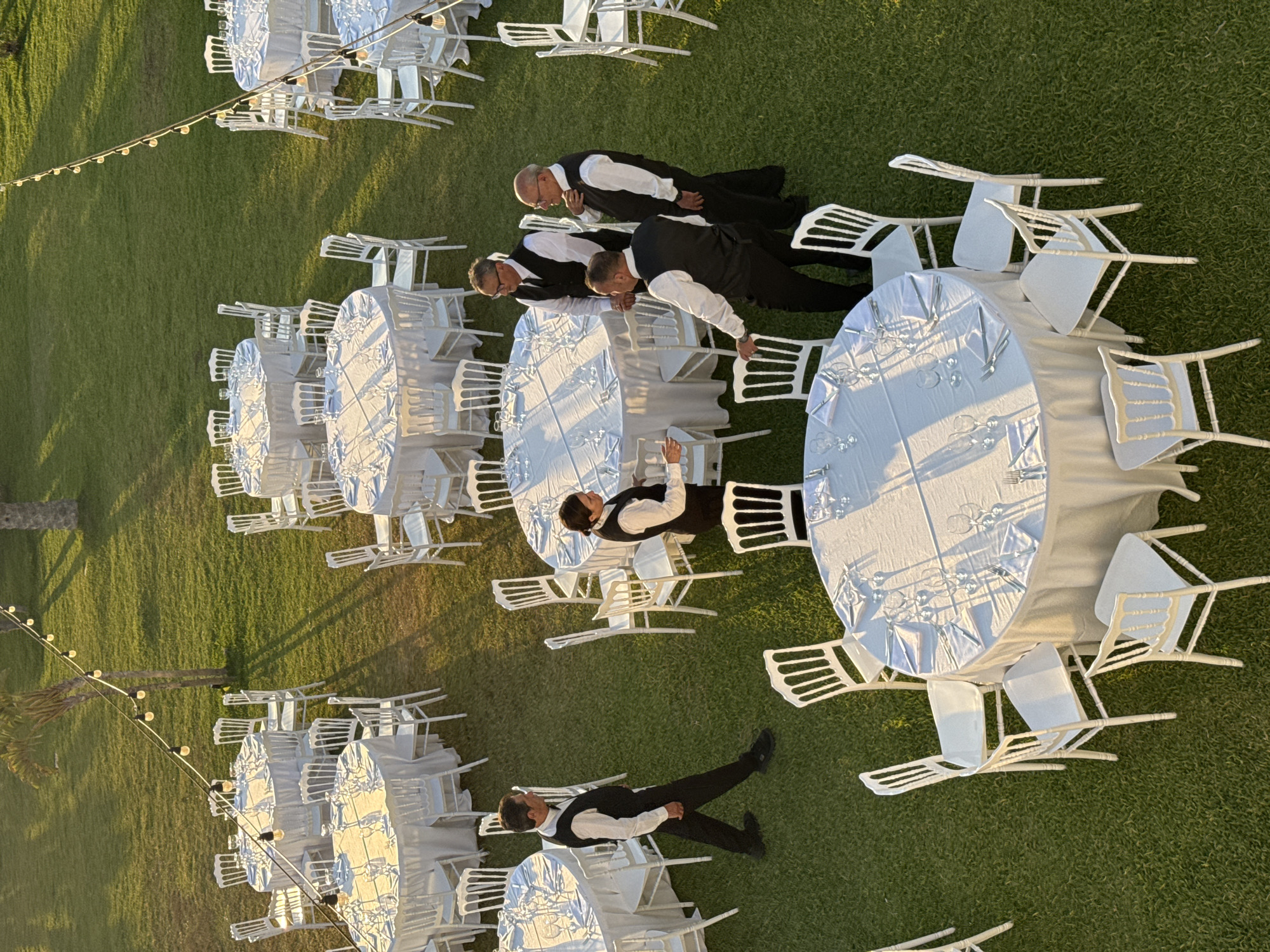 Sunset event setup captured on Italian coastal lawn