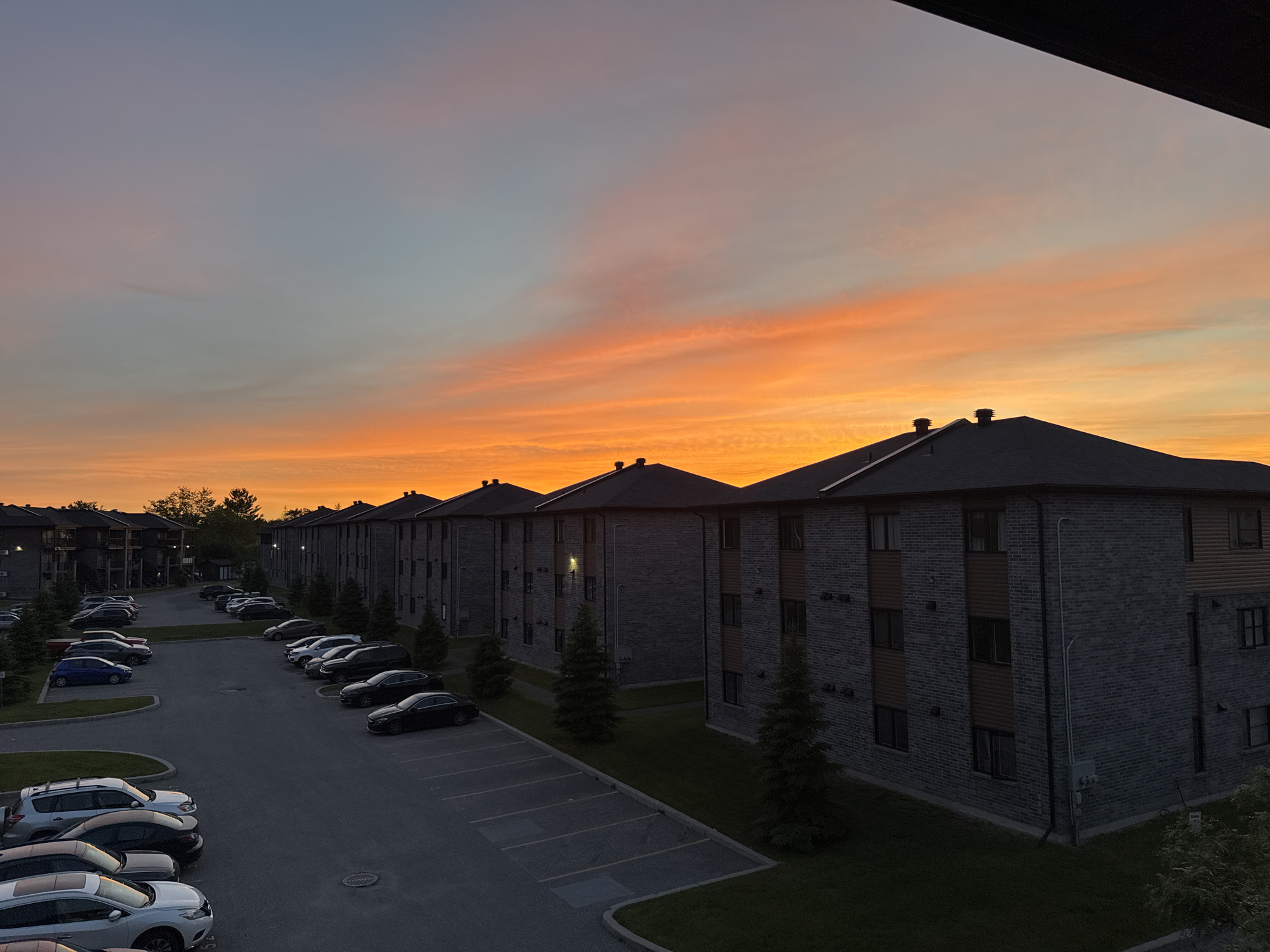 Dramatic sunset captured over Gatineau apartment complex