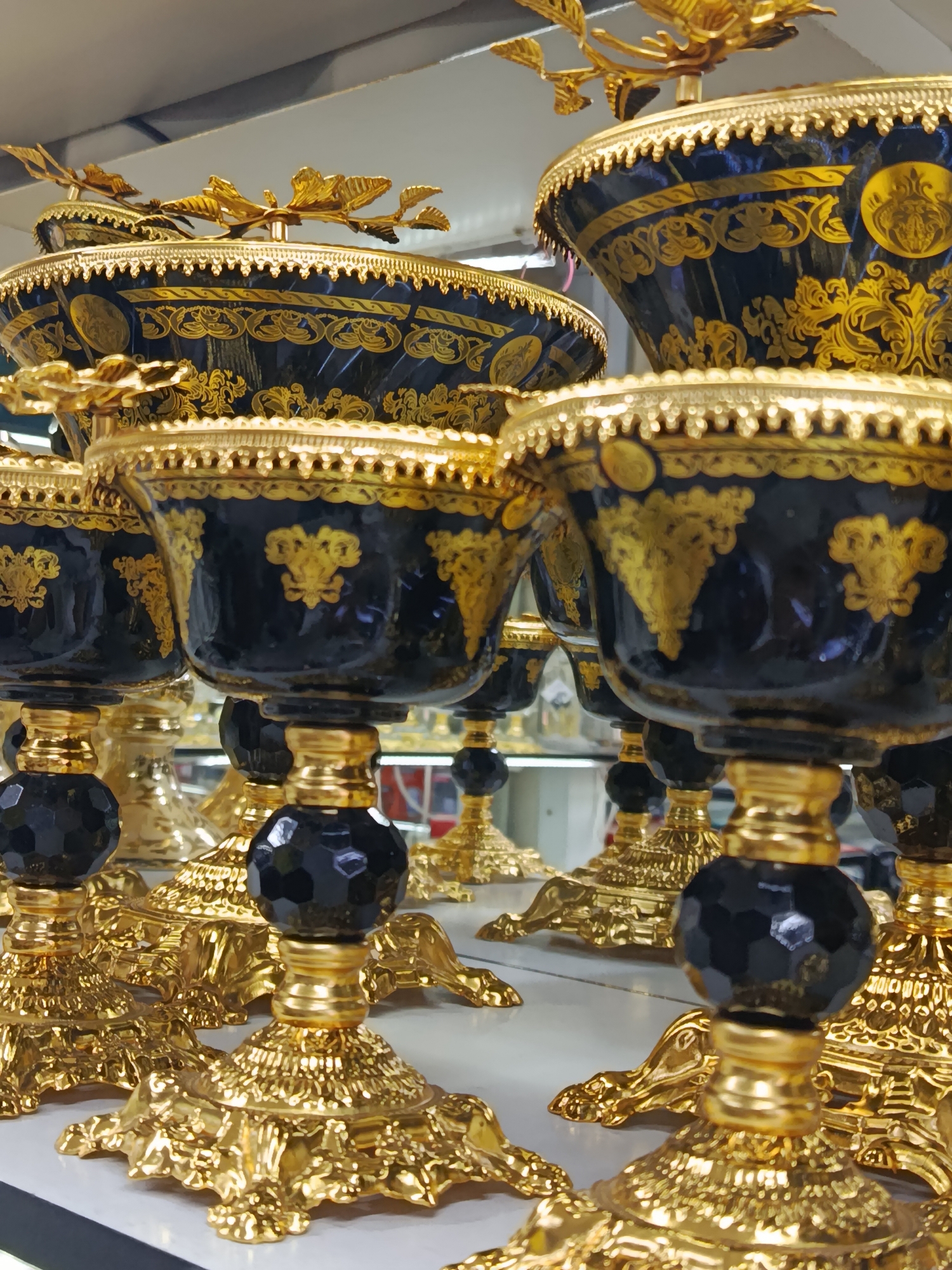 Decorative bowls and goblets displayed in Ghafurov shop