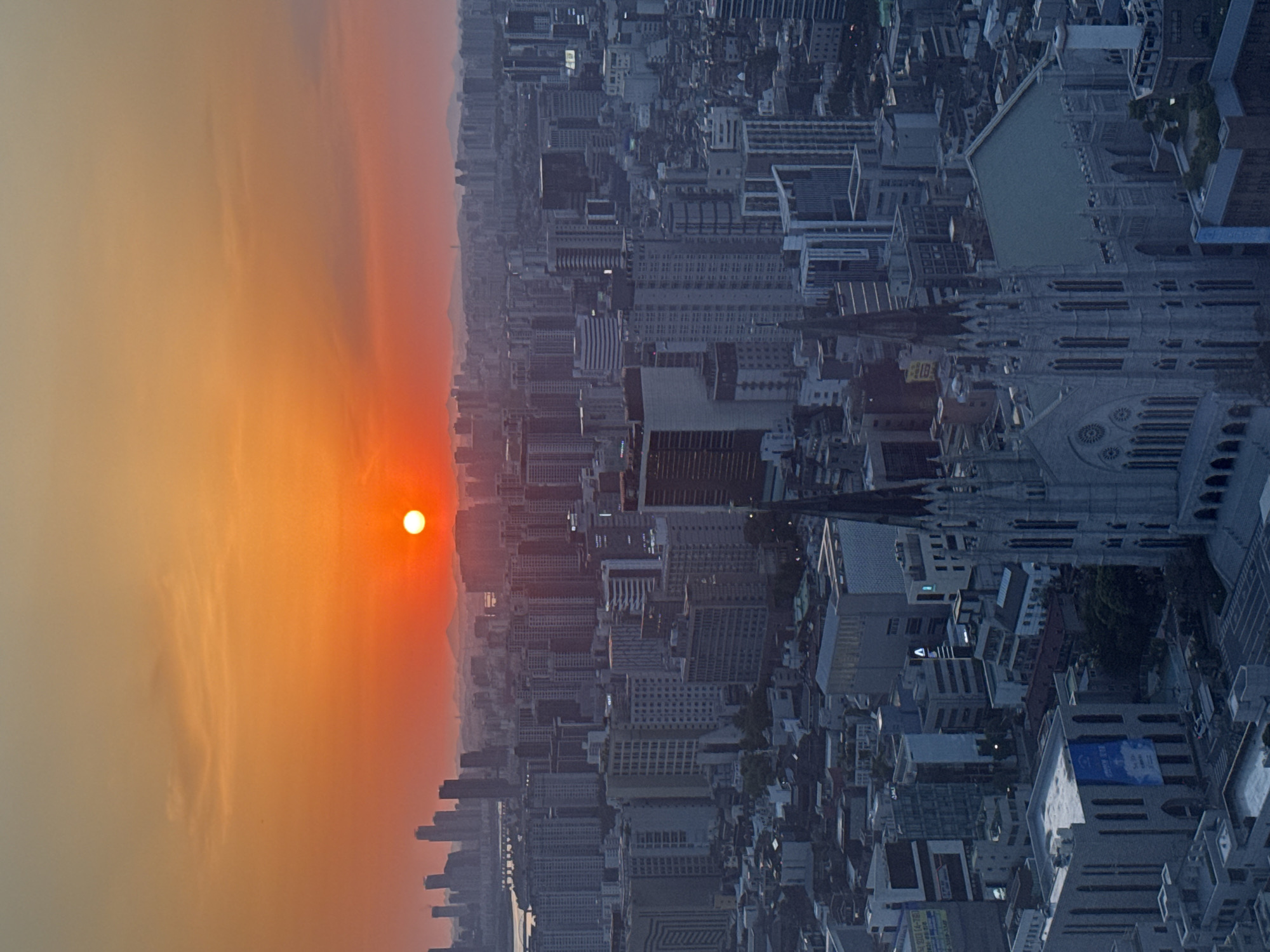 Sunset documented over Seoul skyline from aerial perspectives