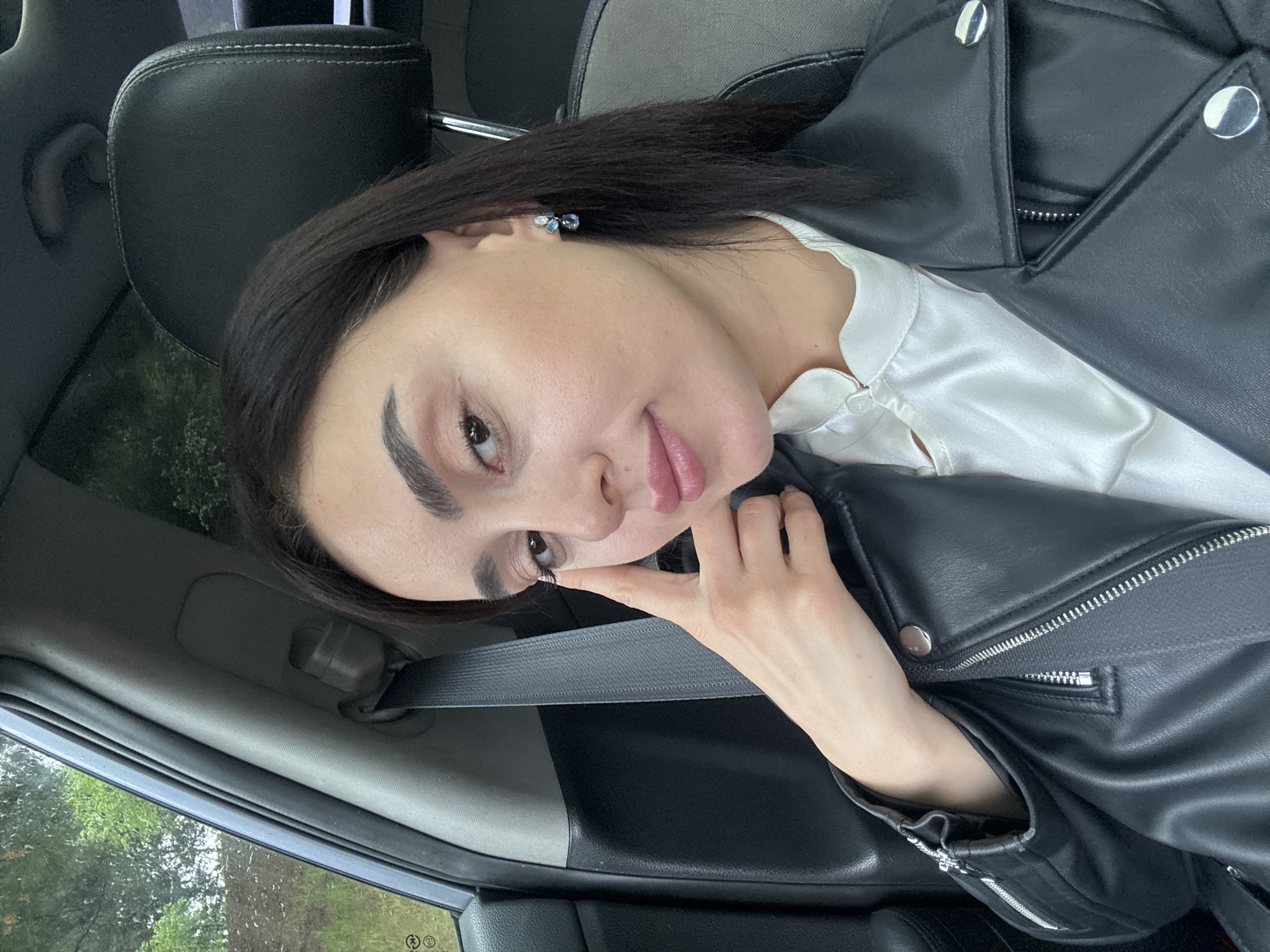Woman Takes Selfies in Car During Tbilisi Traffic