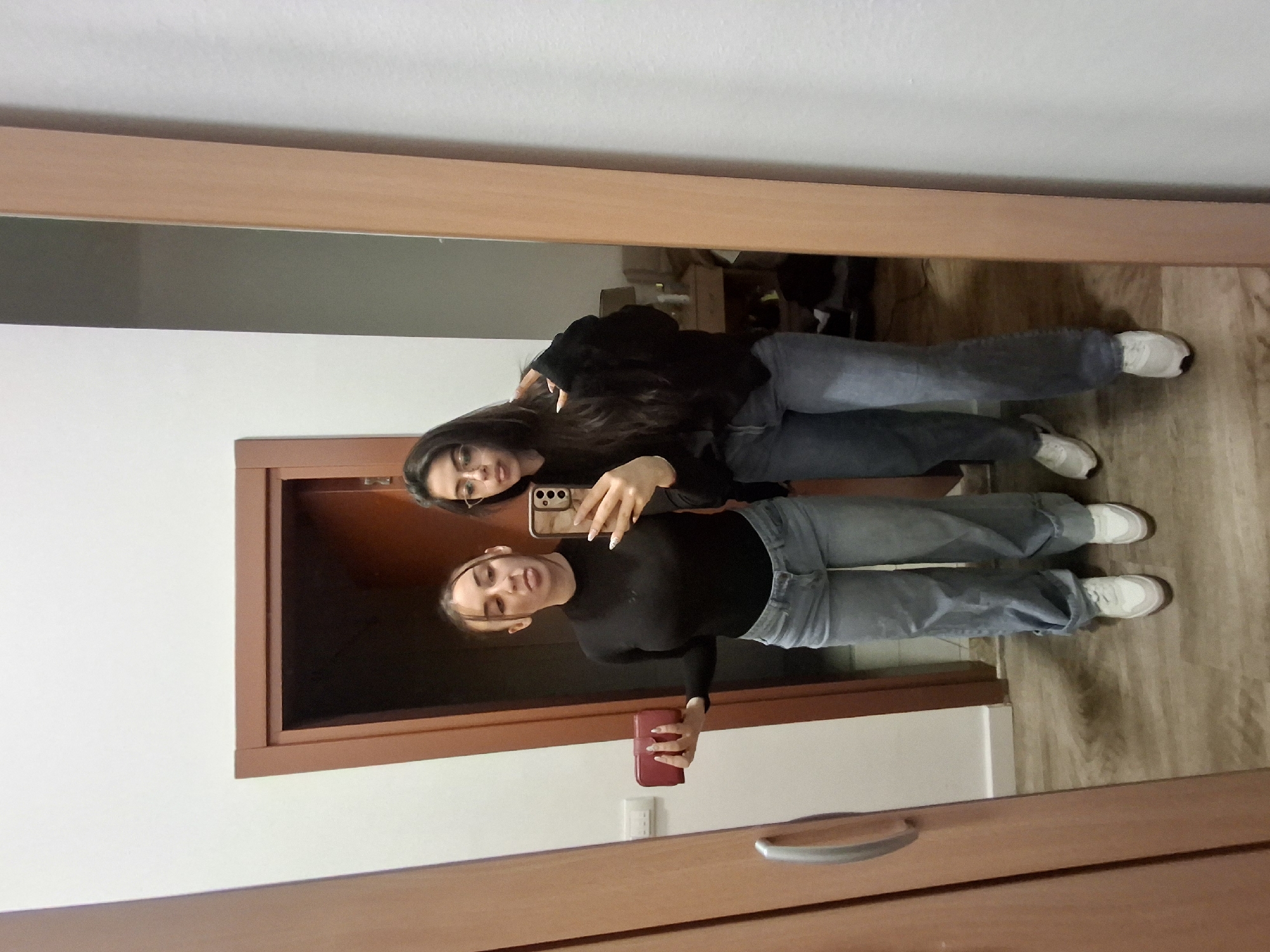 Young women take mirror selfies in Belgrade homes