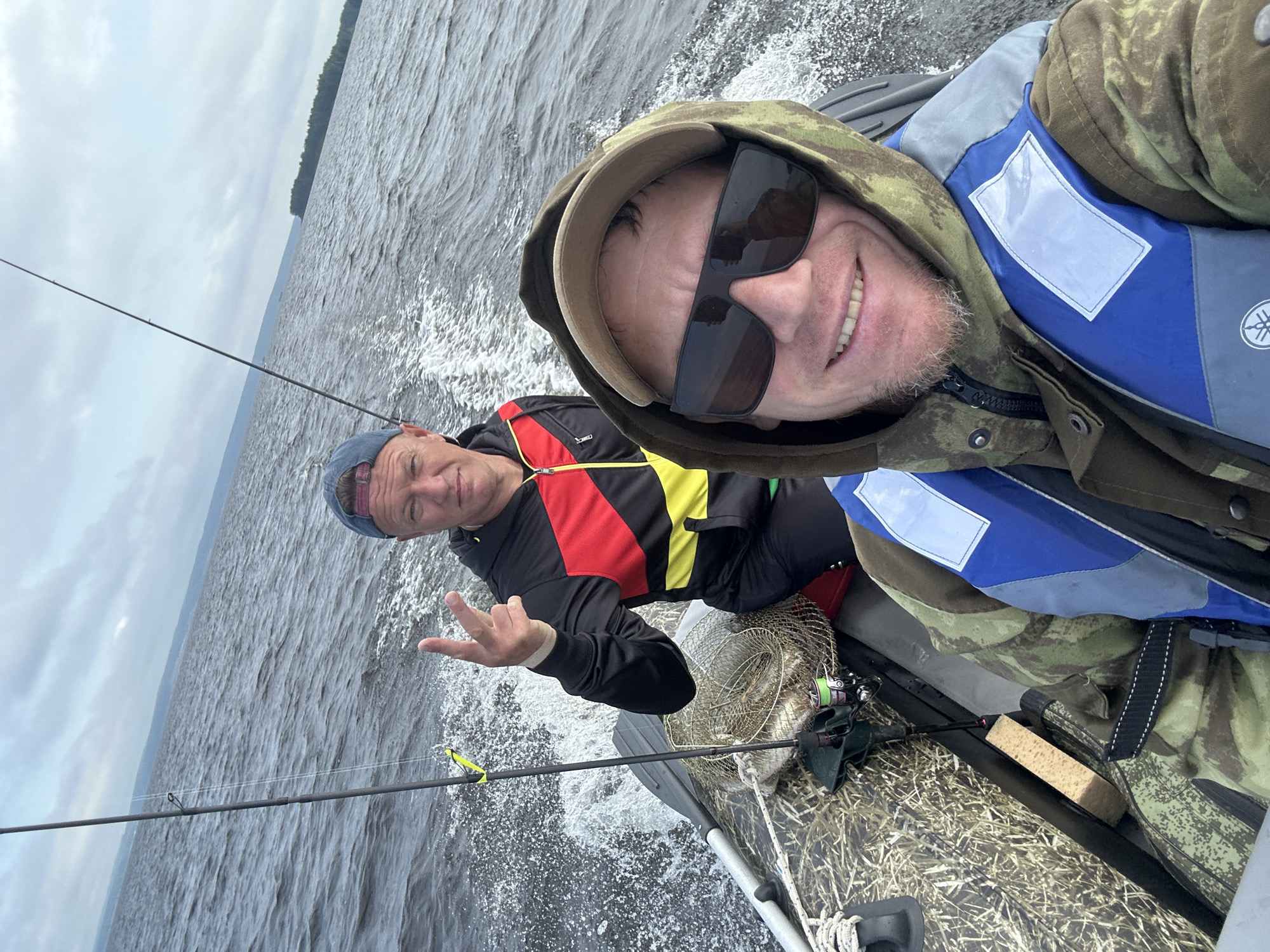 Inflatable boat trip across a Russian lake, July morning