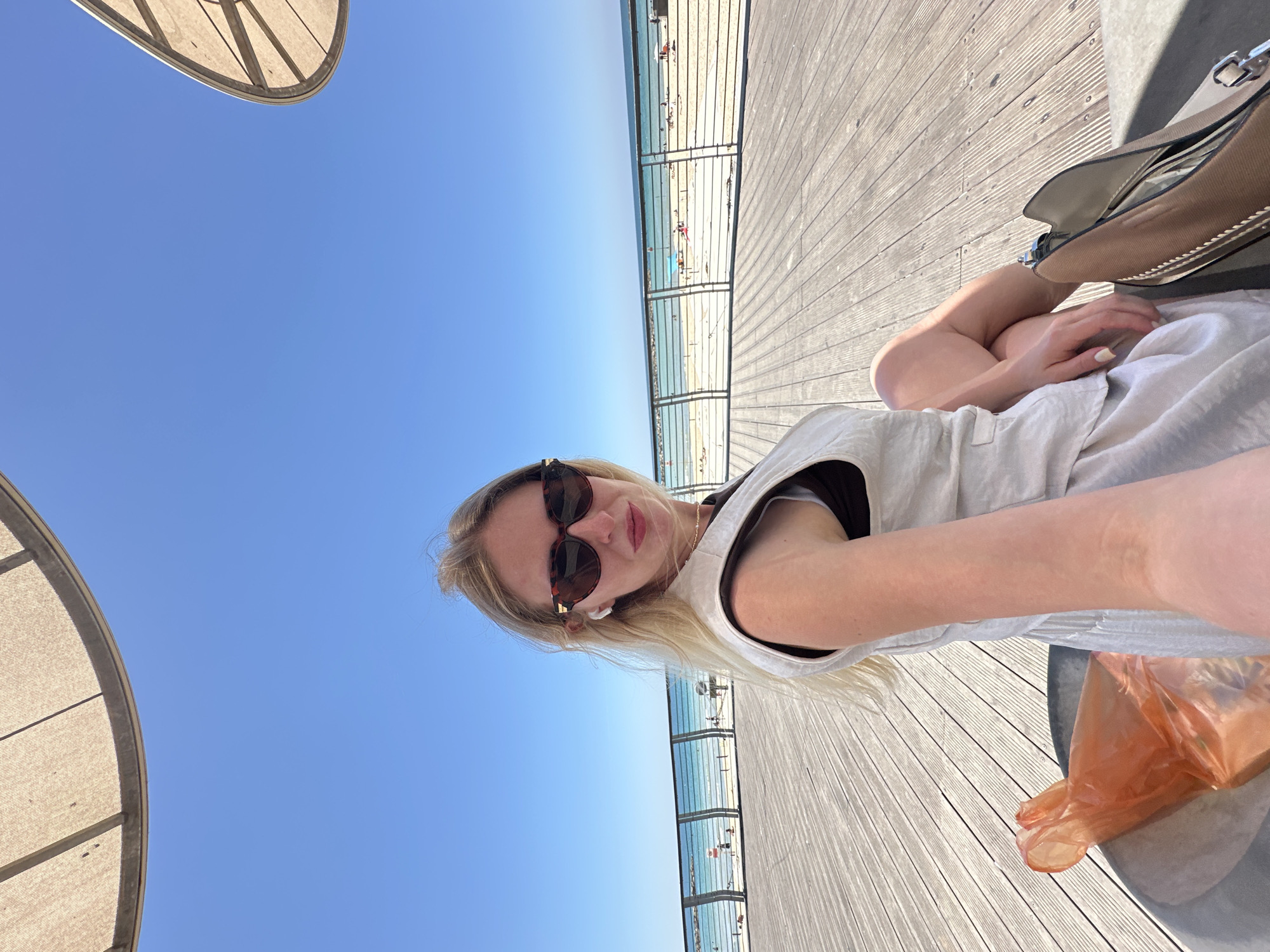 Morning stroll documented along Tel Aviv's sunny coastal promenade
