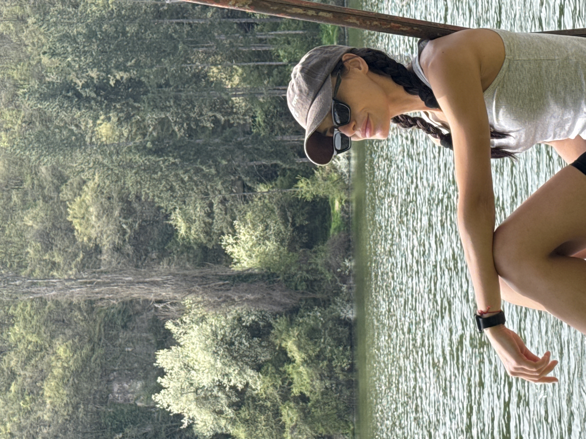Woman enjoys morning moment by water in Pleven park