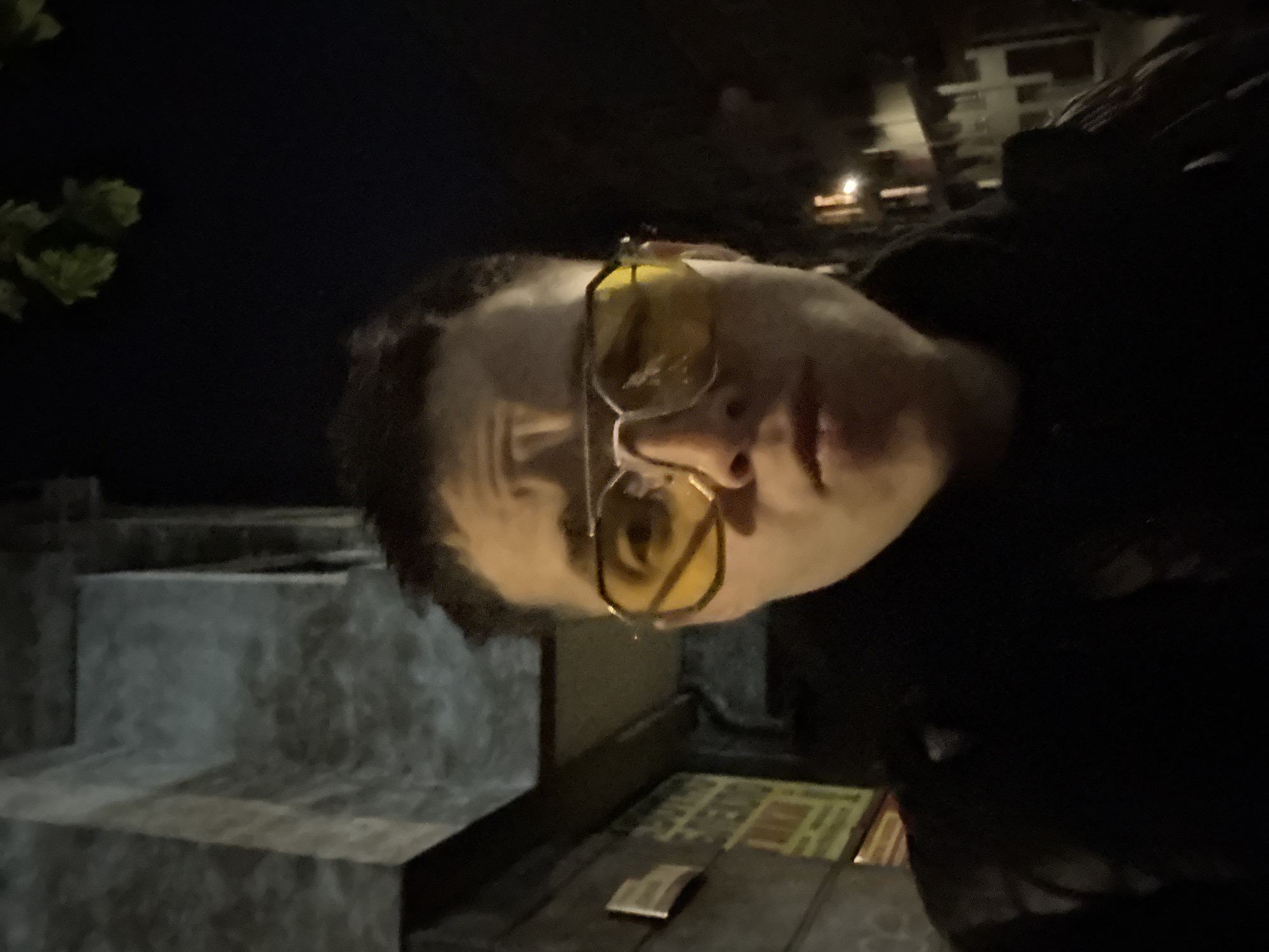 Person with yellow glasses spotted holding sandwich in Sofia