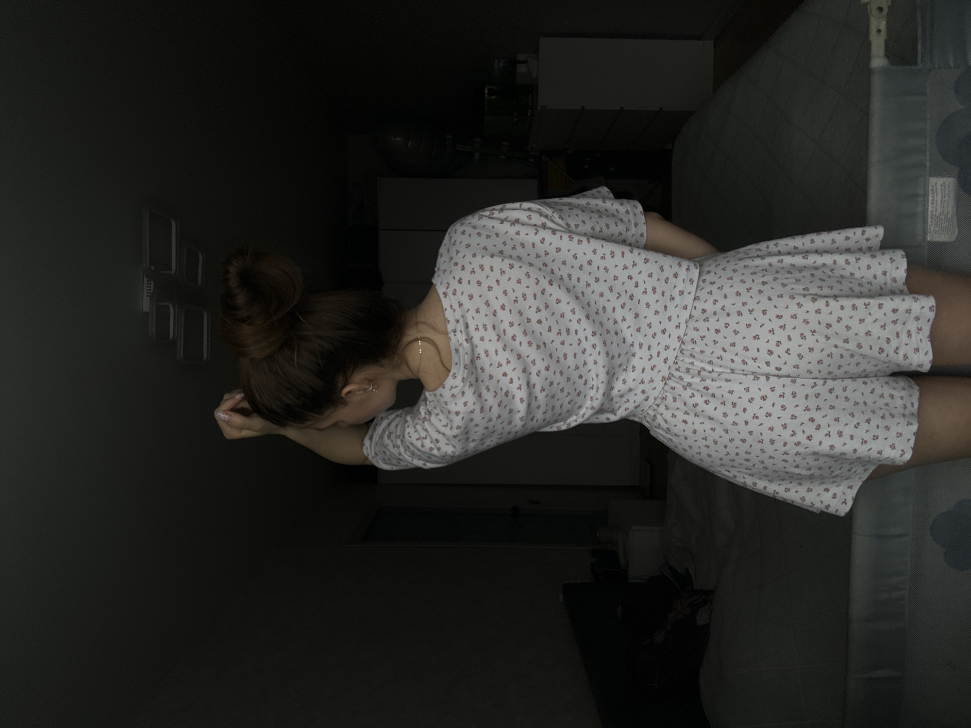 Woman photographed in bedroom setting in Klin, Russia