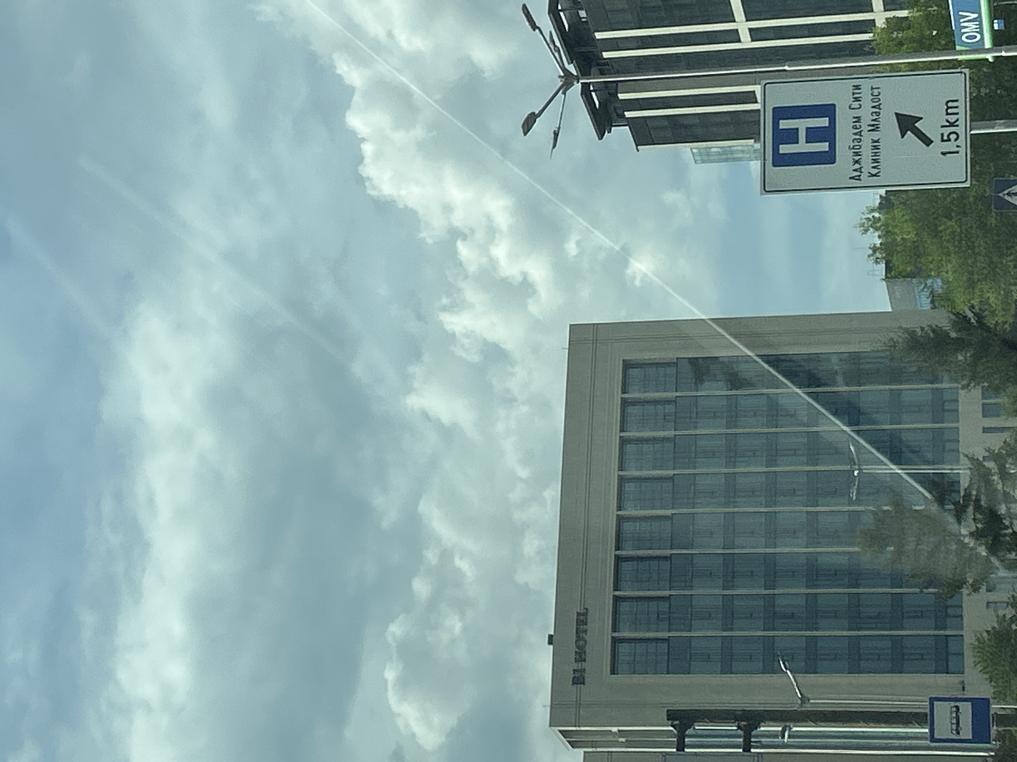 Street-level tour of modern commercial Sofia on a cloudy afternoon