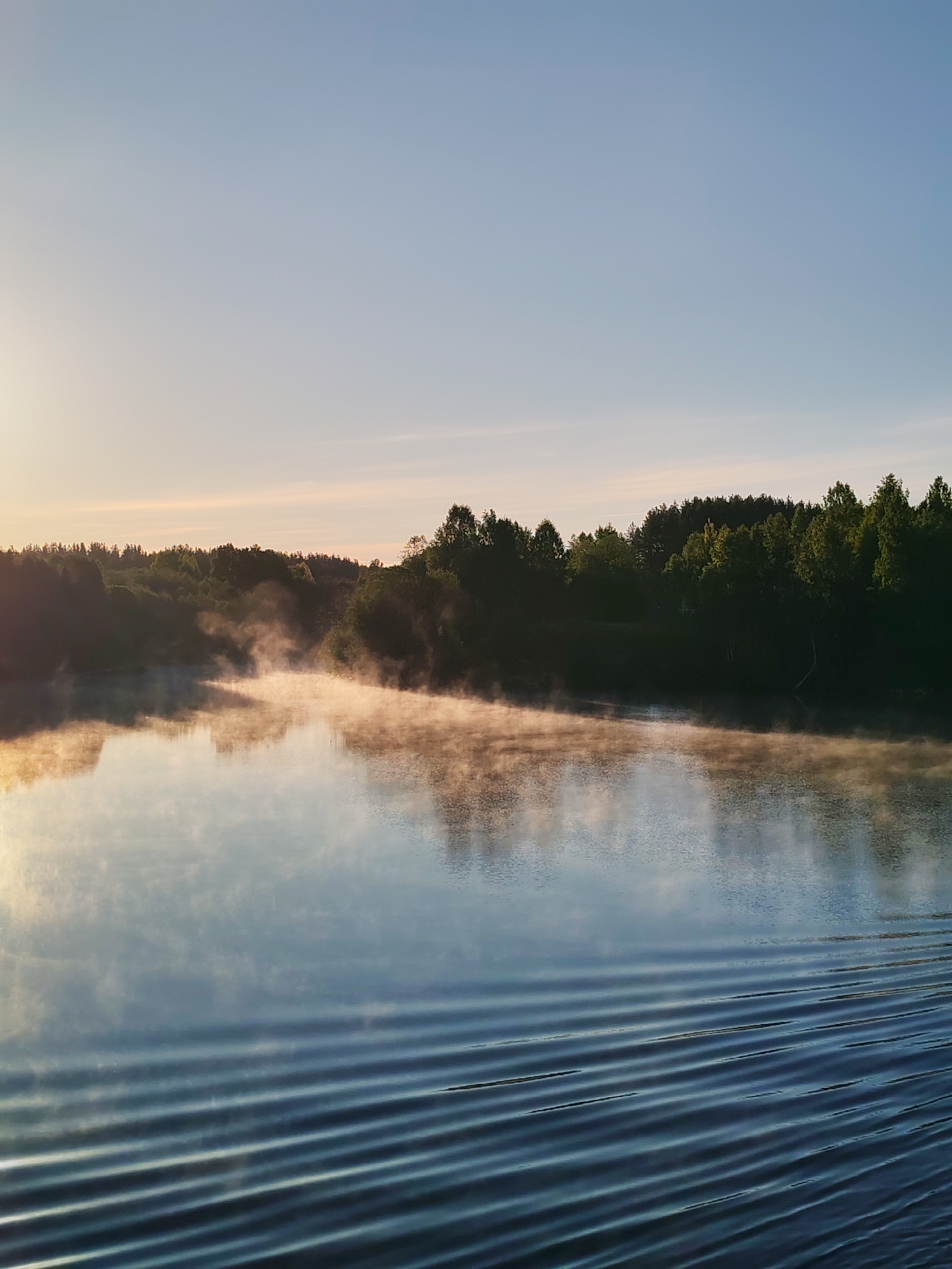 Dawn breaks over Russian waterway near Старое Петровское