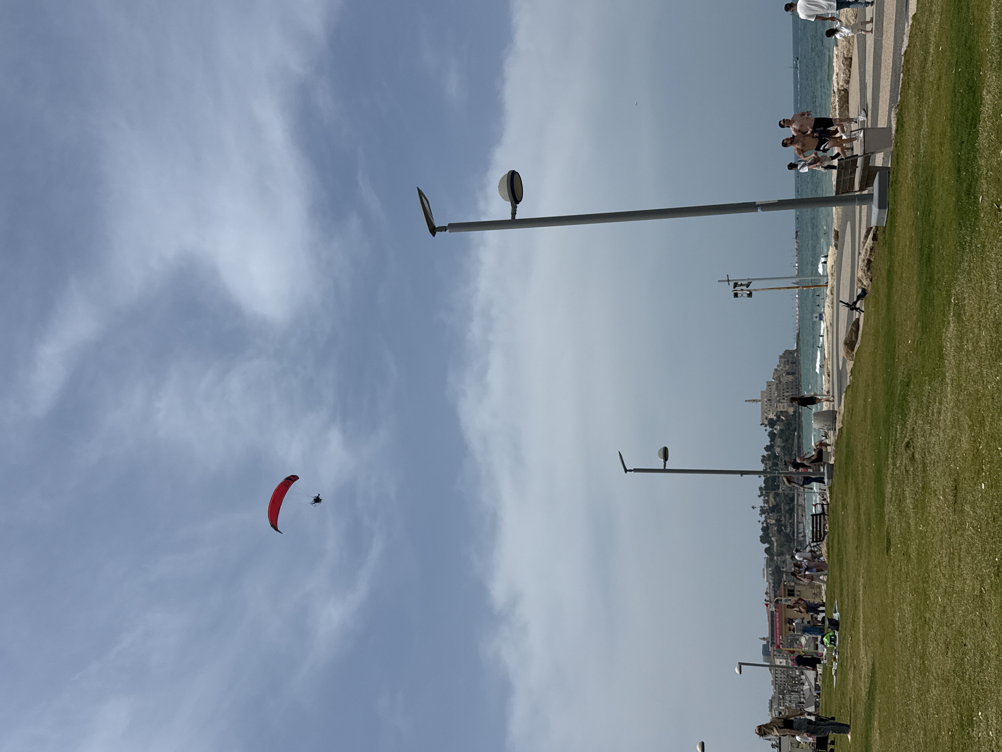 Paraglider spotted over Tel Aviv coast on sunny morning