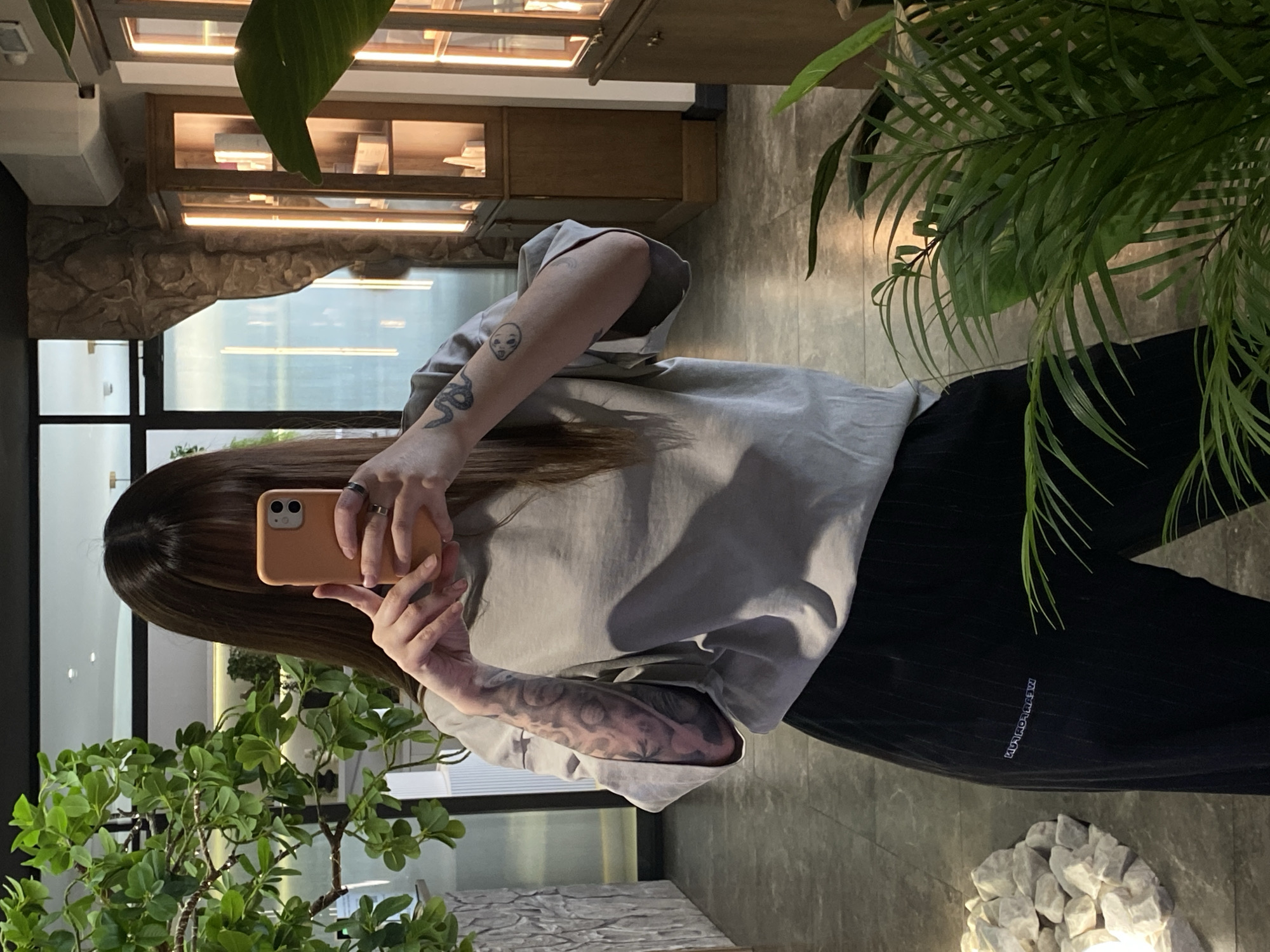 Person takes multiple selfies indoors in Votkinsk, Russia