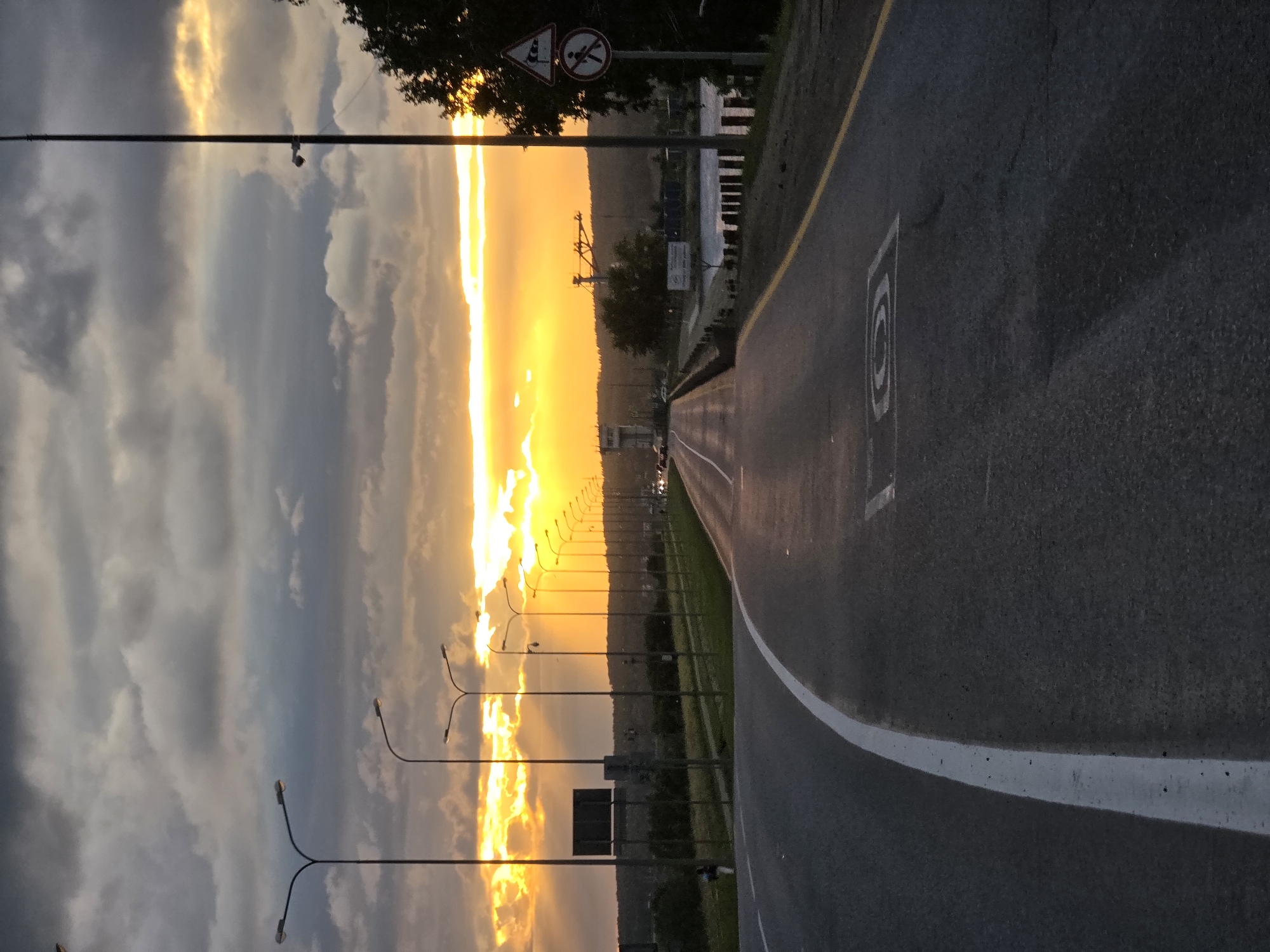 Chaikovsky at golden hour — roads, sunset skies, and street life