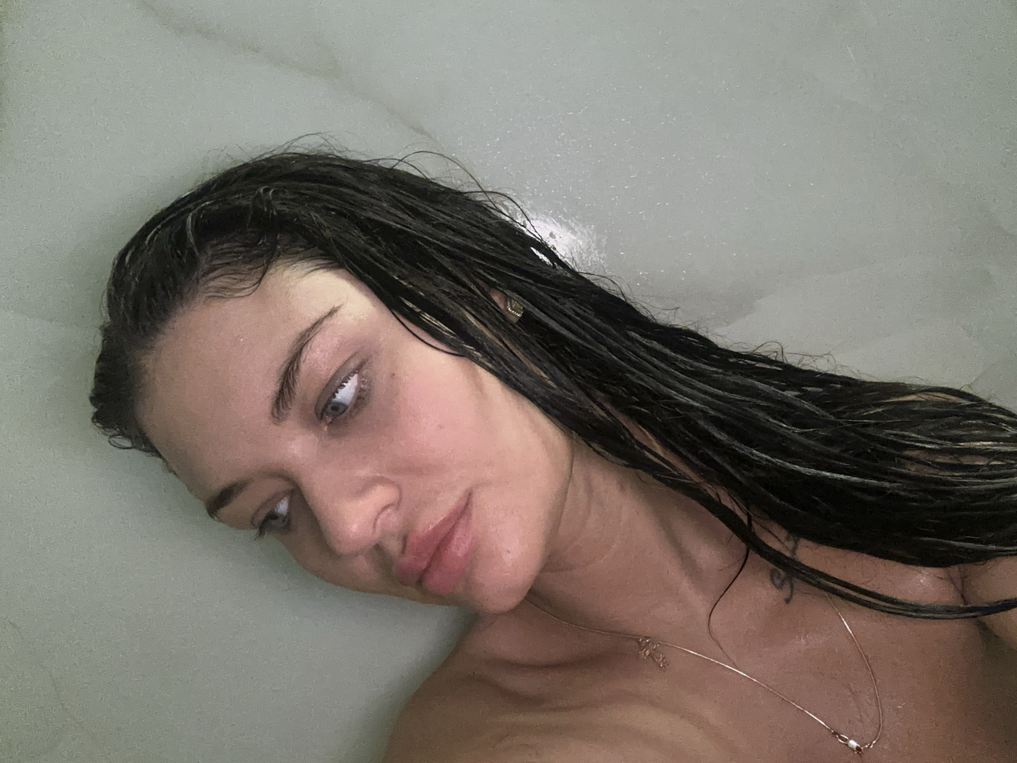 Woman photographed in private bathroom setting, Moscow