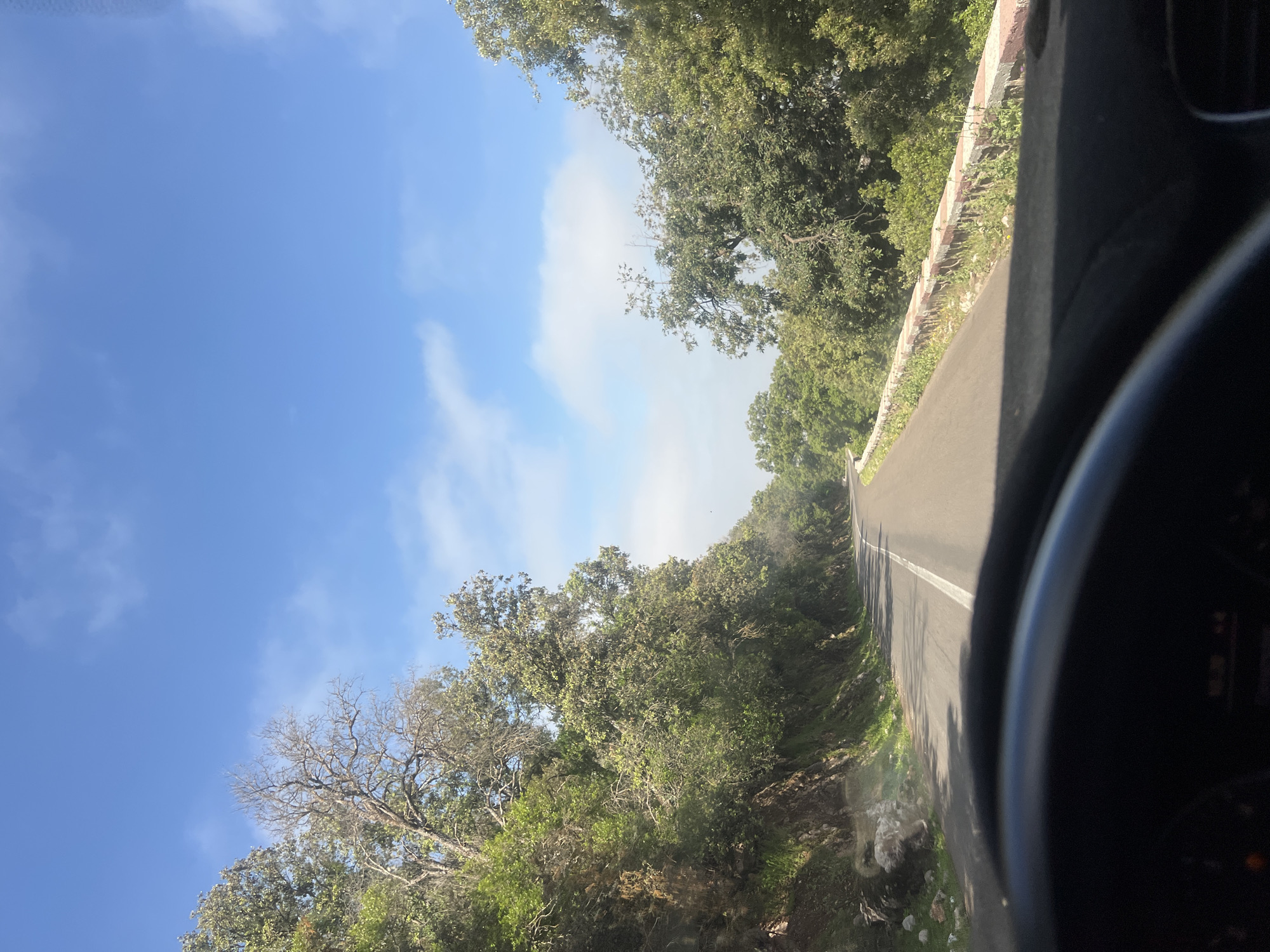 Vehicle journey documented on winding roads in Ouaouizert, Morocco
