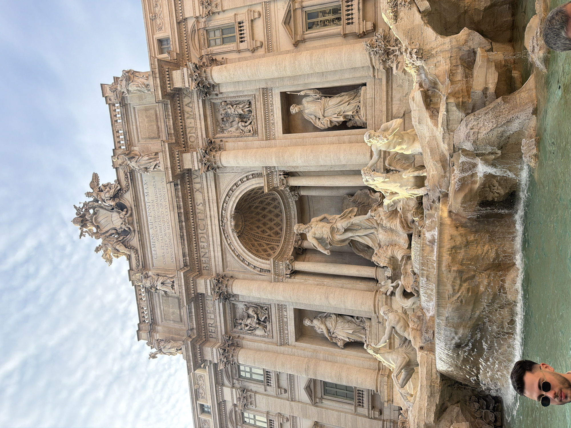 Tourists photograph Rome's iconic Trevi Fountain on Sunday afternoon